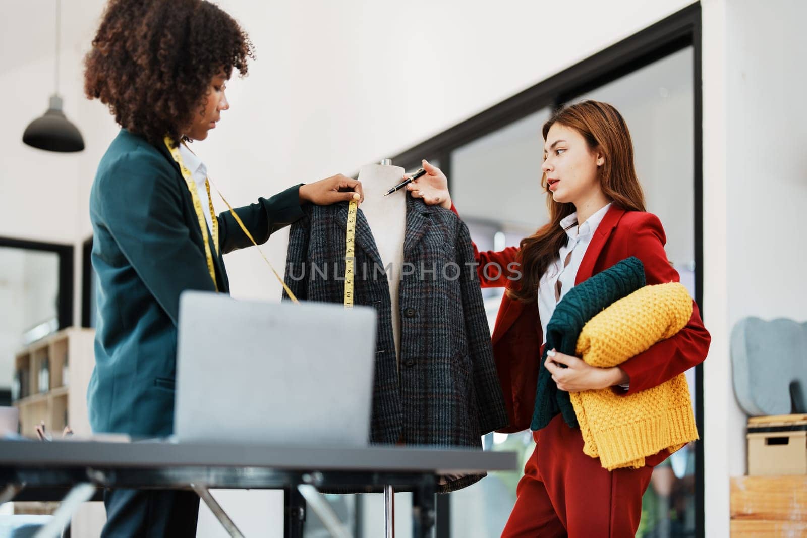 Multi ethnic young teen african american and asian woman fashion designer stylish and friend working at fashion Business studio.