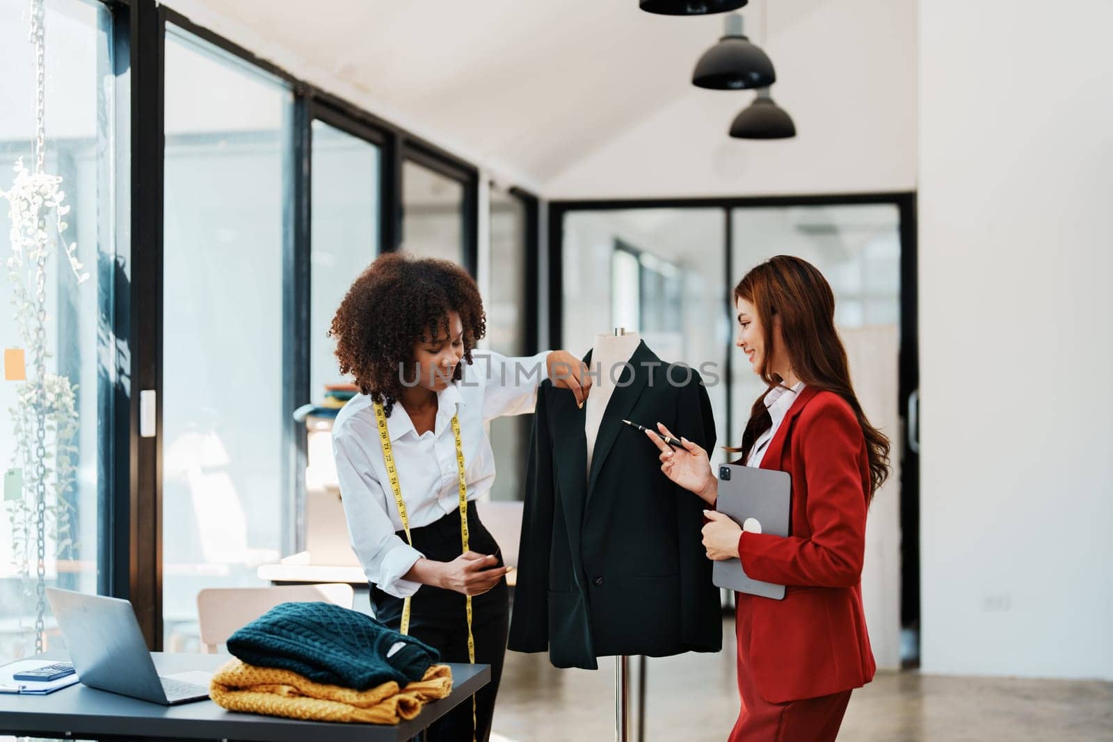 Multi ethnic young teen african american and asian woman fashion designer stylish and friend working at fashion Business studio.