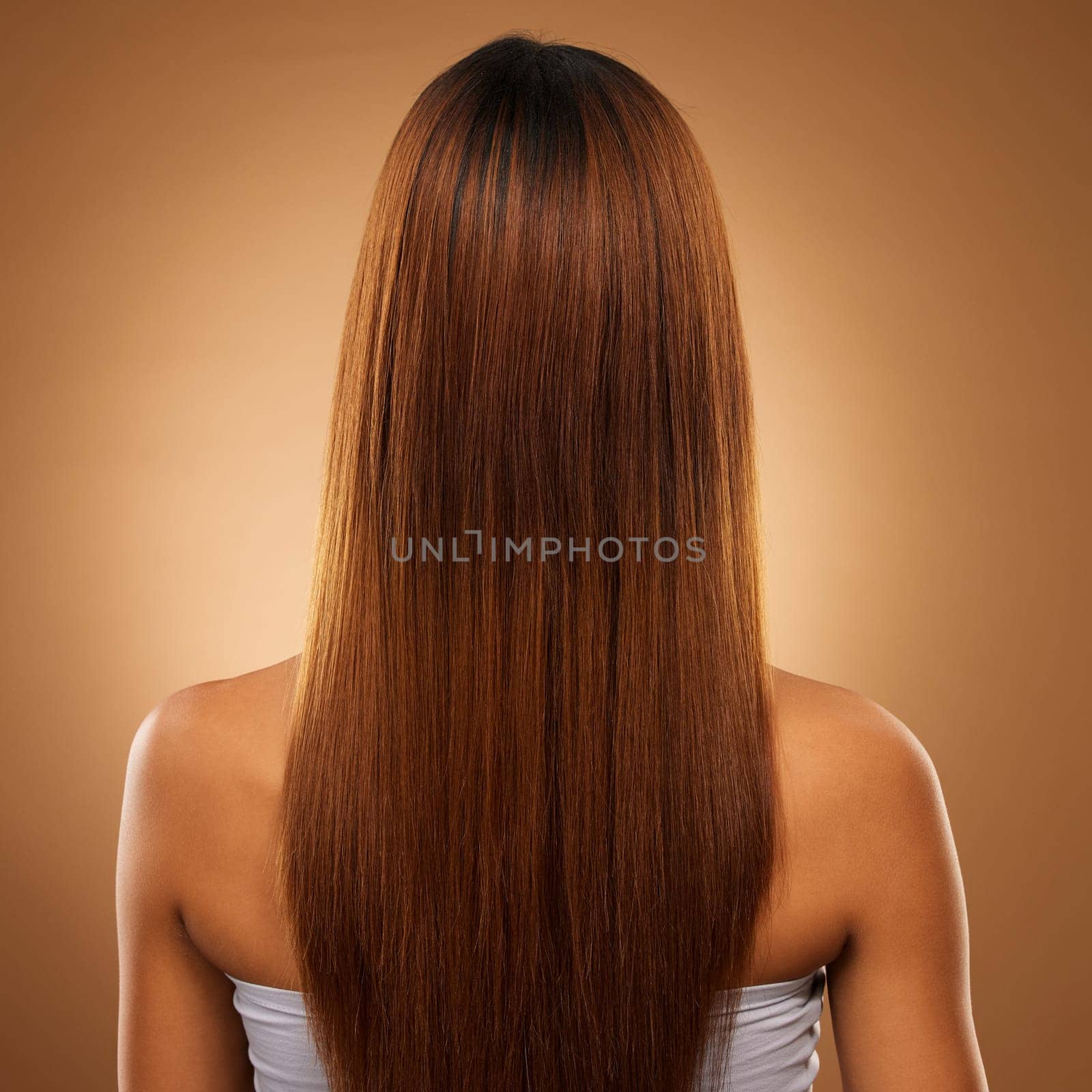 Back of hair, beauty and woman in studio for shampoo, wellness and keratin treatment on brown background. Hairdresser mockup, salon and girl with hairstyle for growth, haircare texture and cosmetics.