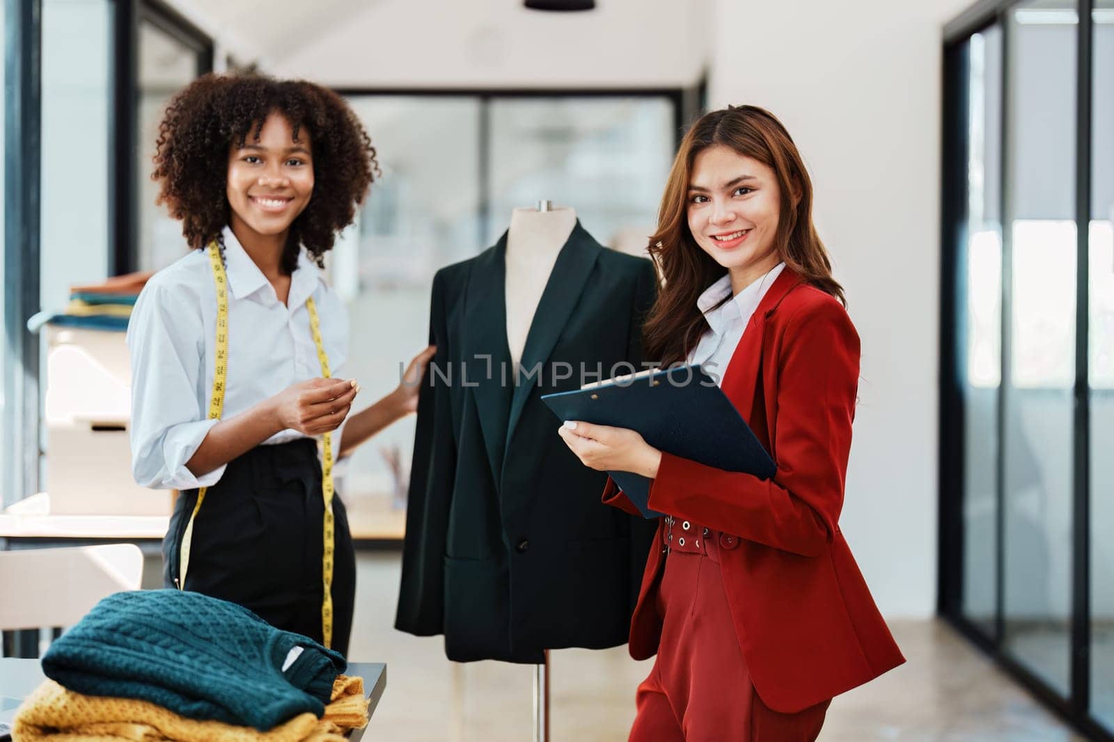 Multi ethnic young teen african american and asian woman fashion designer stylish and friend working at fashion Business studio.