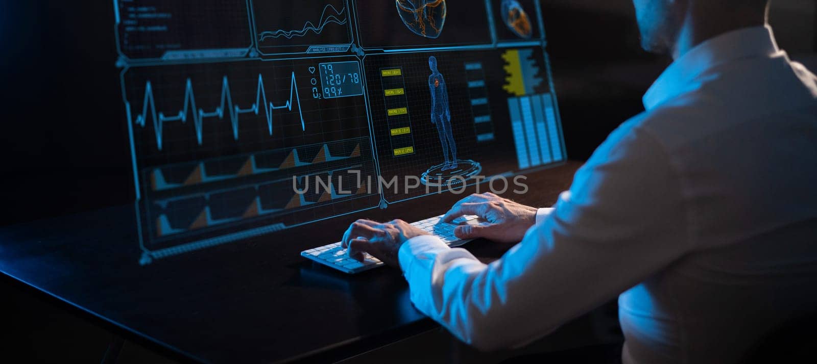 Close-up of male hands on a keyboard in the dark in front of a virtual menu. Readings on the life support monitor