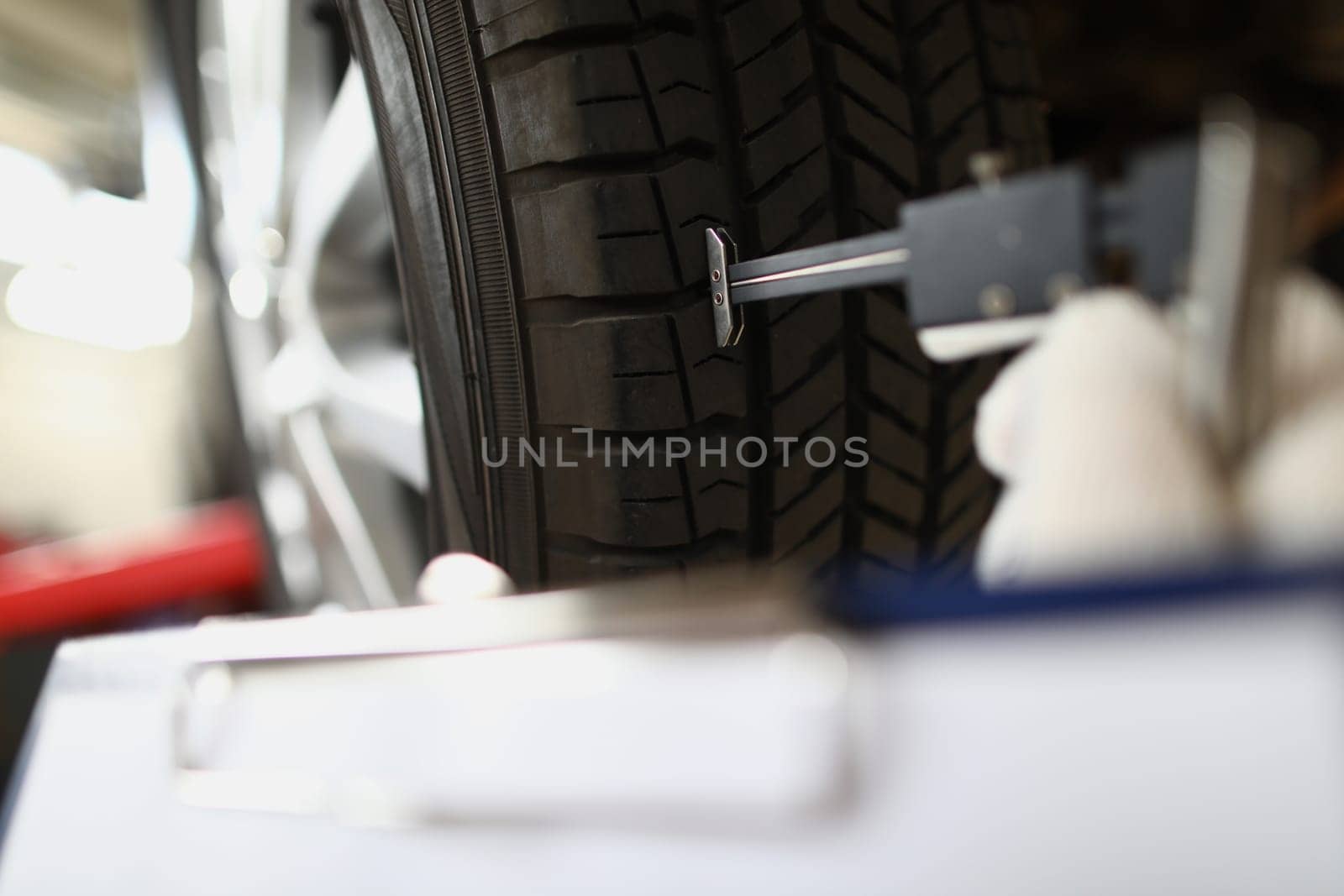 Visiting tire shop and assessing car tire damage by kuprevich