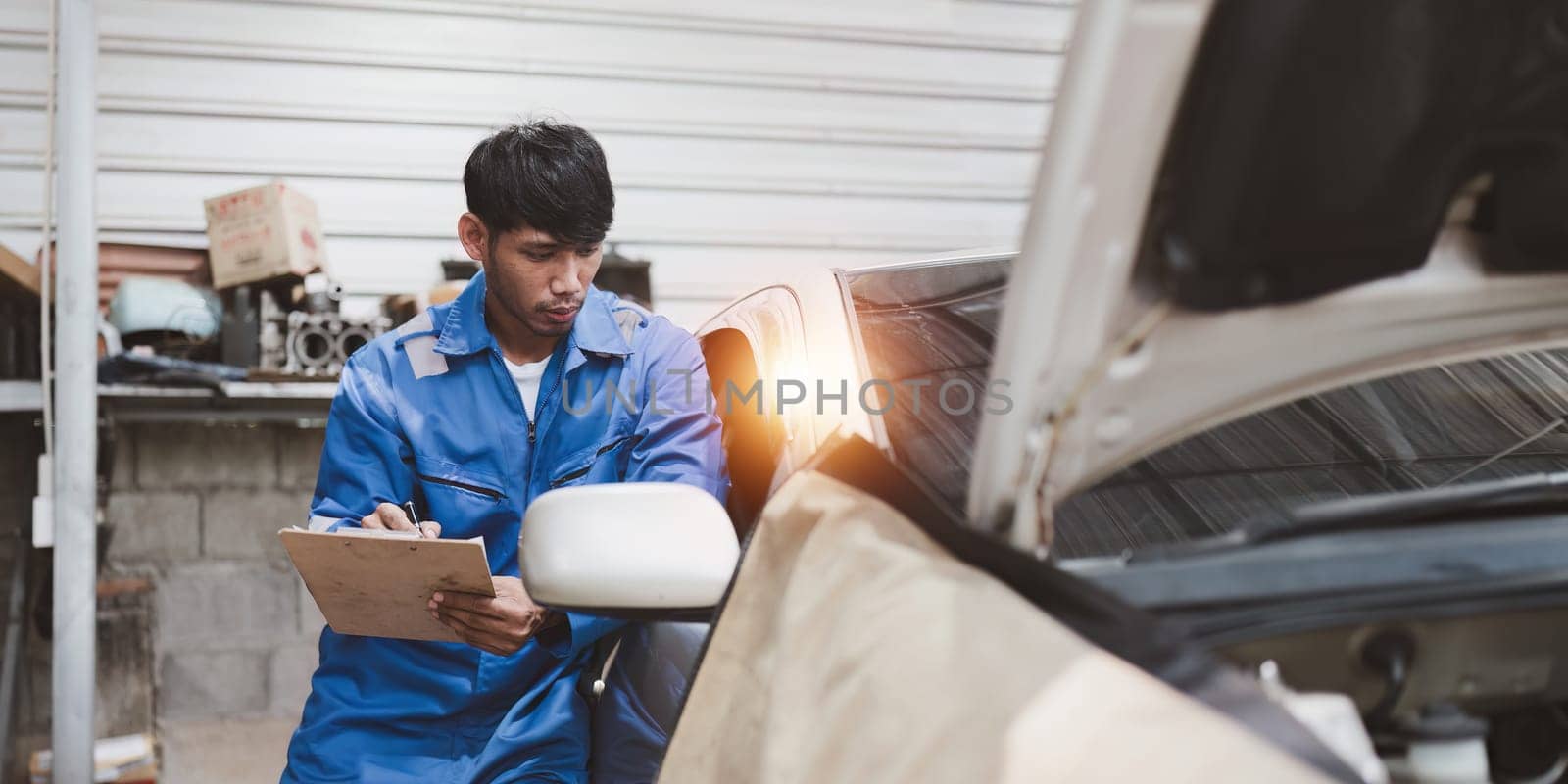 Expert auto mechanic repair and service customer service work on car at garage. automobile car concept.