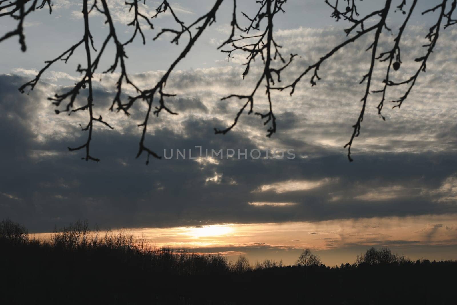 Natural sunset or sunrise. Bright dramatic Sky. Countryside Landscape under Scenic Colorful Sky at Sunset. Sun over skyline, Horizon
