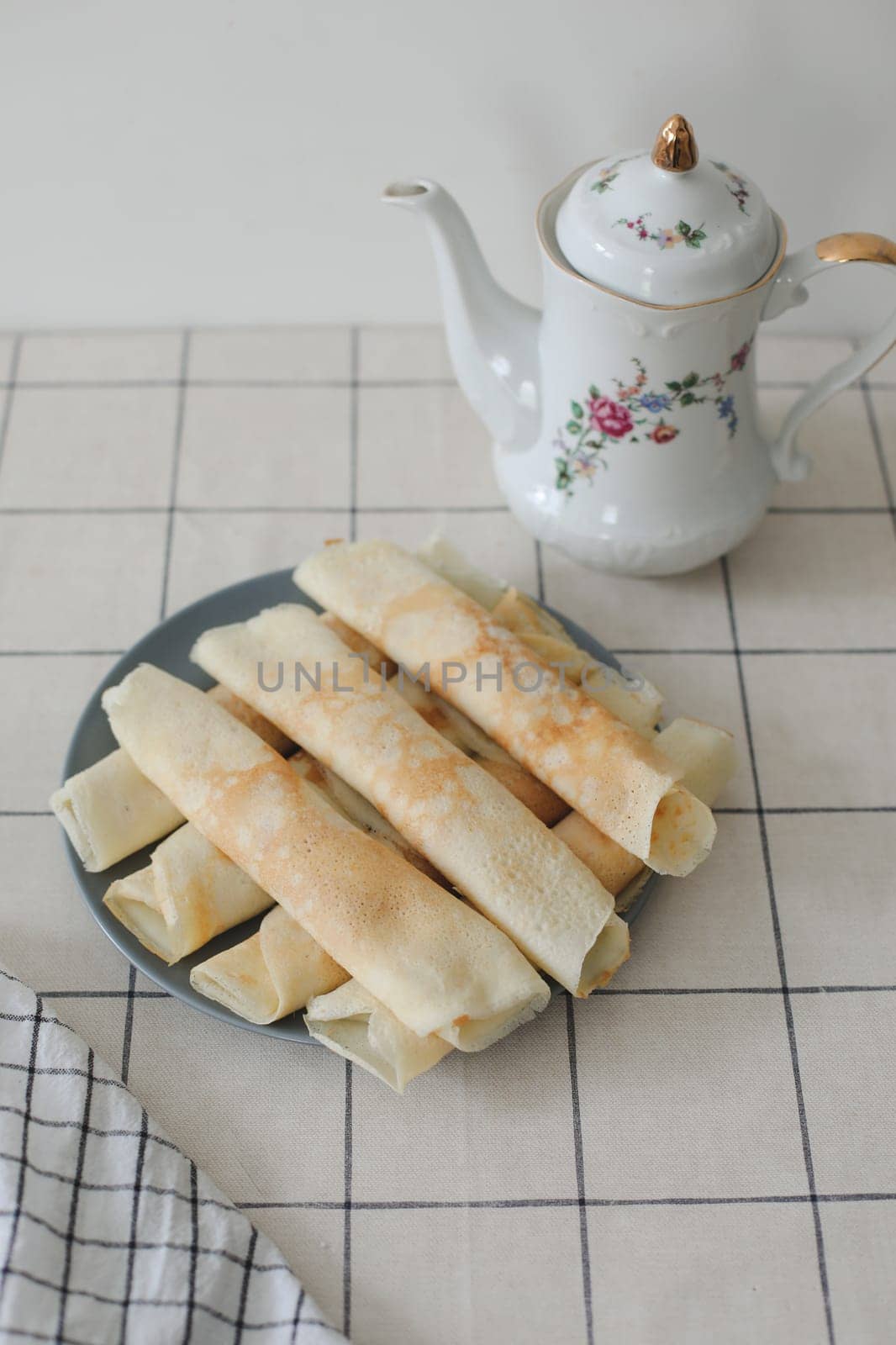 Thin pancakes, crepes for breakfast, making crepes, food photography