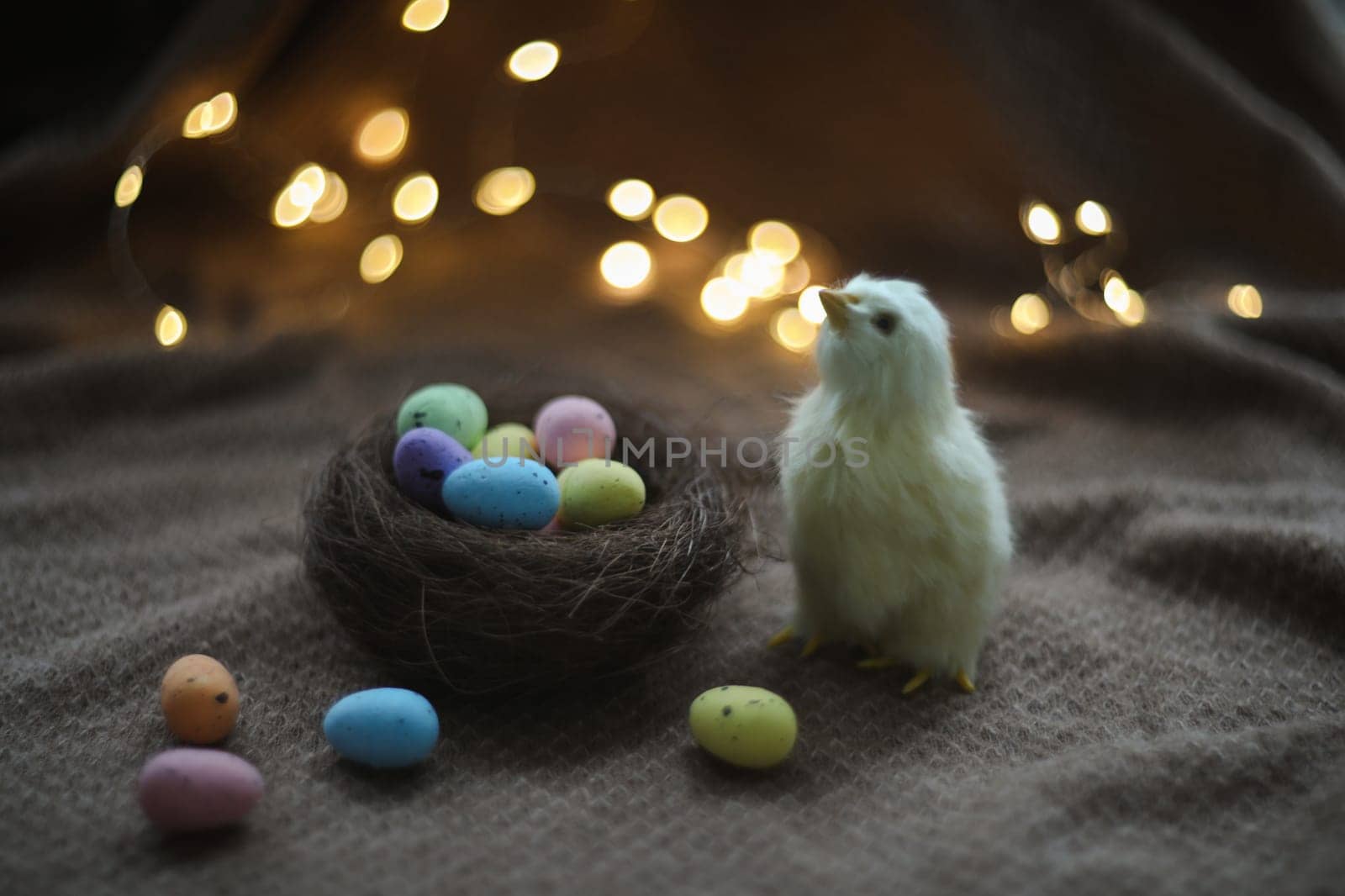 cute decorative Easter chicken on abstract blurred white background. festive composition for Easter holiday, spring season. template for design. copy space.