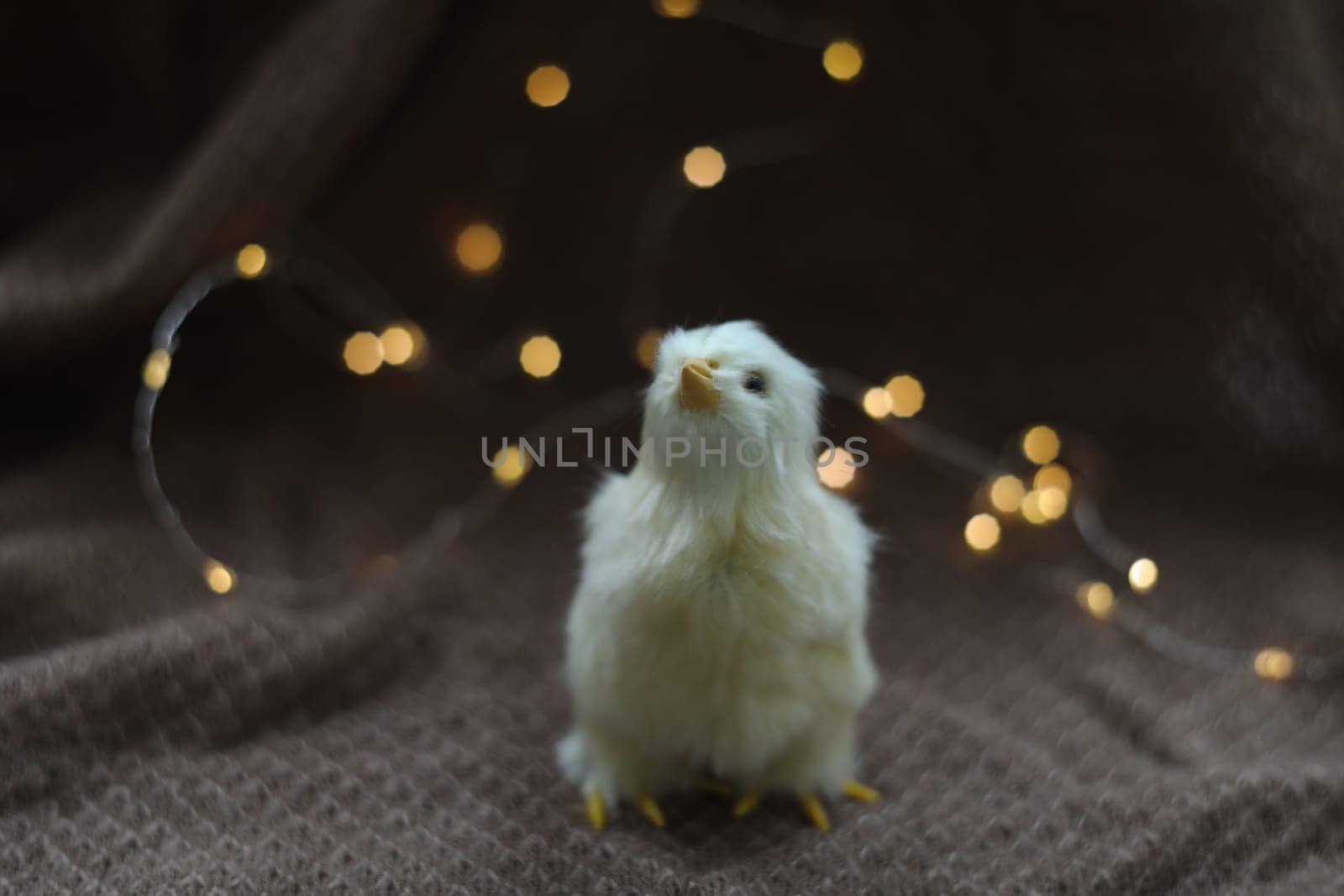 cute decorative Easter chicken on abstract blurred white background. festive composition for Easter holiday, spring season. template for design. copy space.