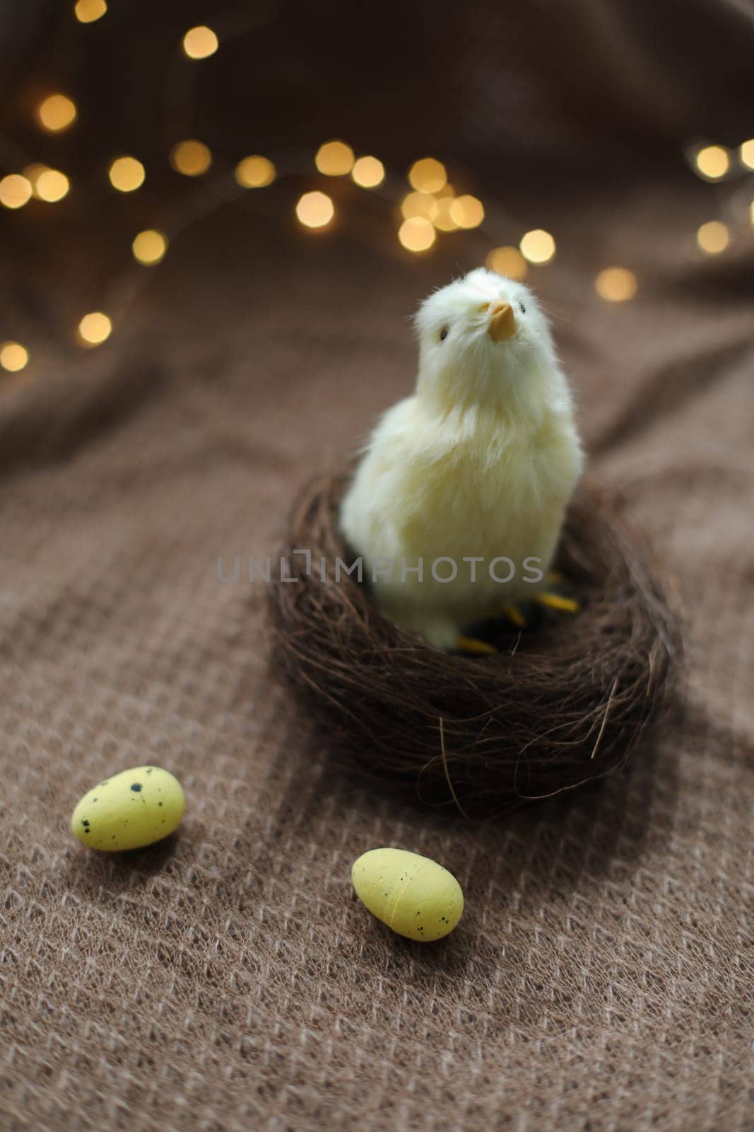 cute decorative Easter chicken on abstract blurred white background. festive composition for Easter holiday, spring season. template for design. copy space.