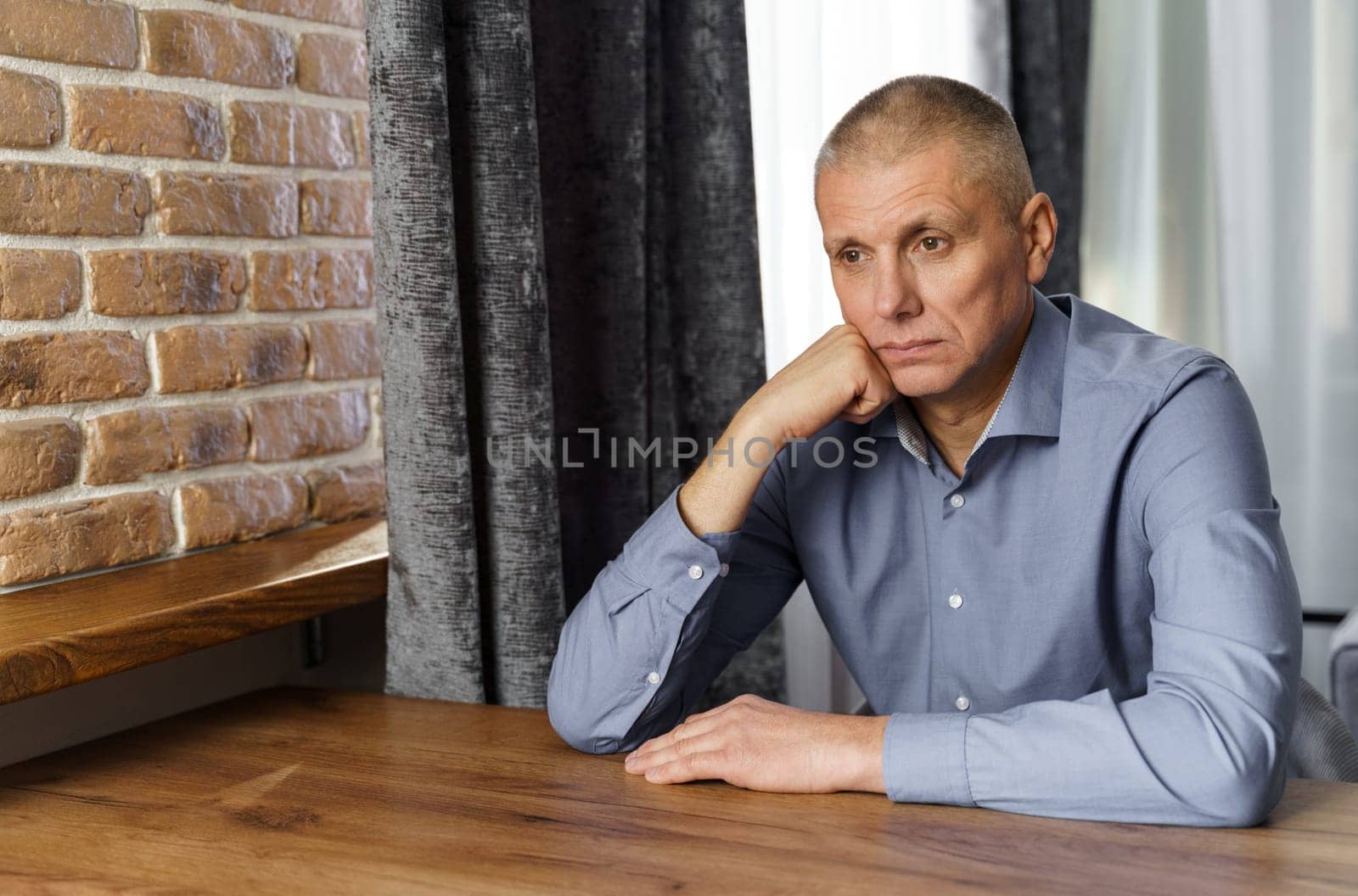 Portrait of a pensive middle-aged man sitting at a table. by Sd28DimoN_1976