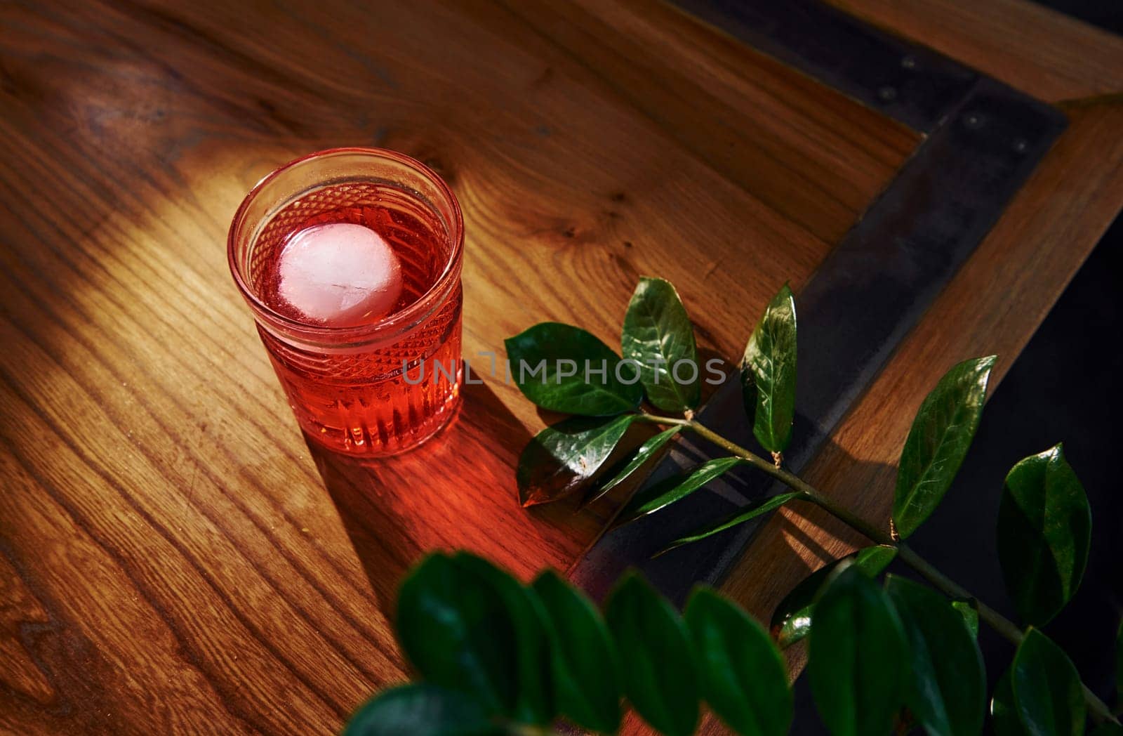 Close up view of fresh summer cocktail on the wooden table.