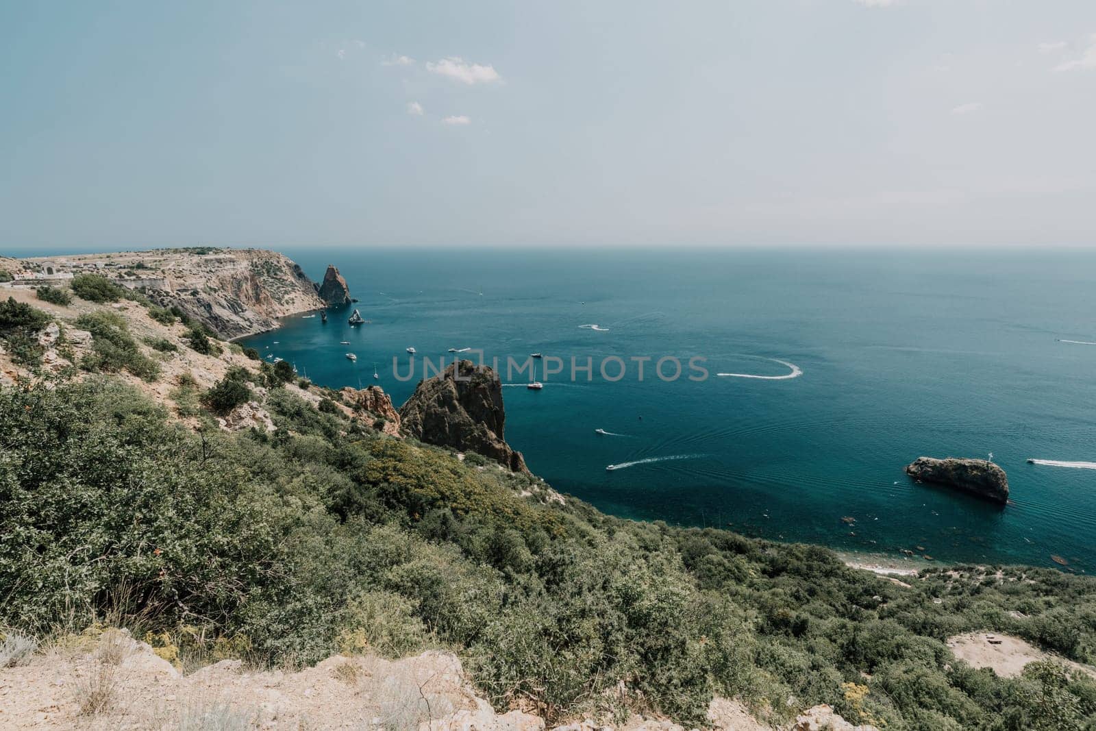 Aerial panoramic view of beautiful sunset above sea. Beautiful seascape. Sun glare, small waves on the water surface. Evening. Horizon. Nobody. No people. Copy space. Never-ending beauty of nature