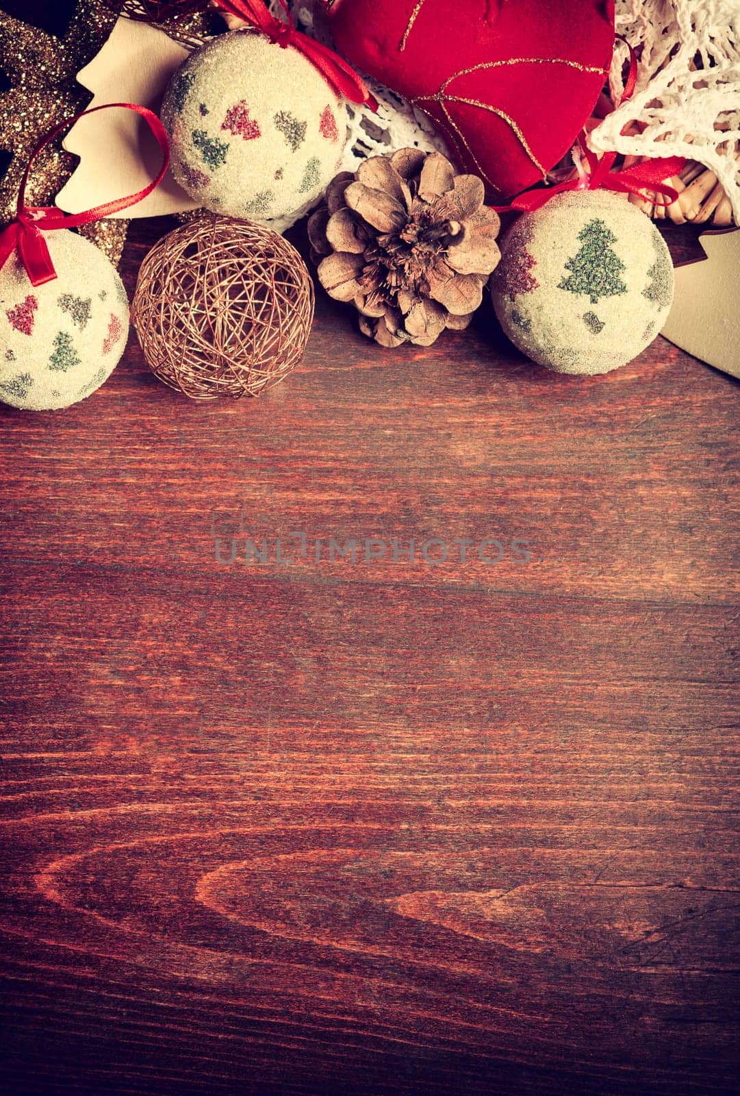 Christmas decor in vintage toning on wooden background by DCStudio