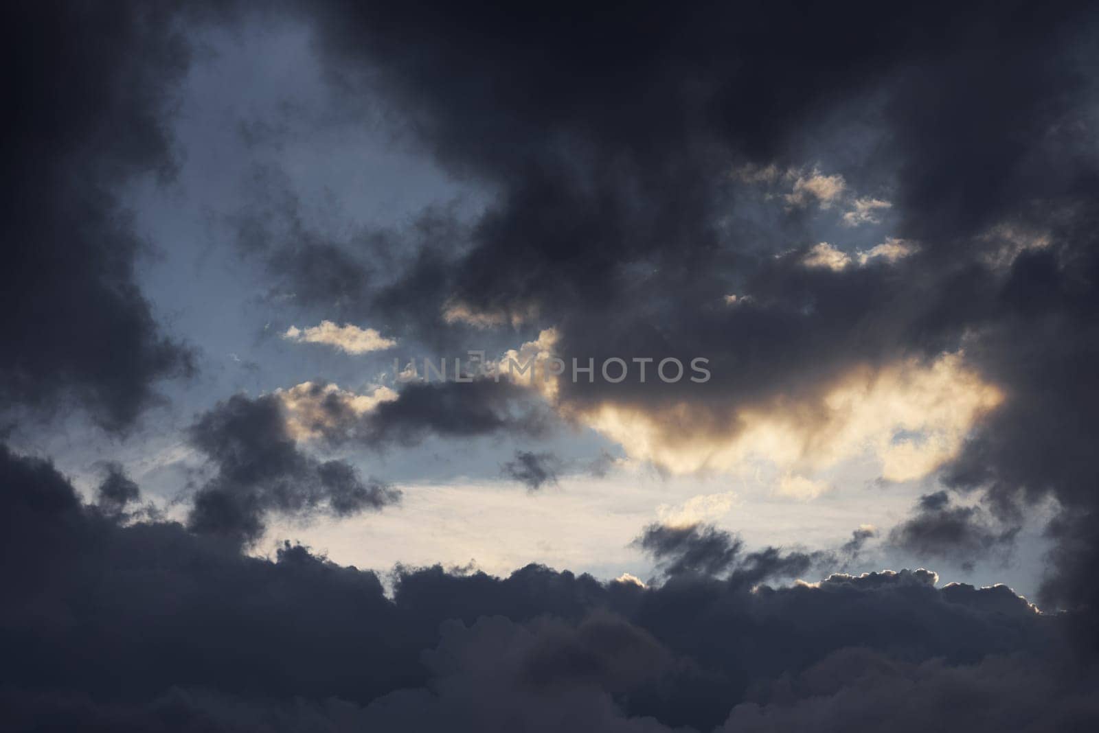 Majestic dramatic sky. Before the storm. Beautiful sunlight. Captured at daytime.