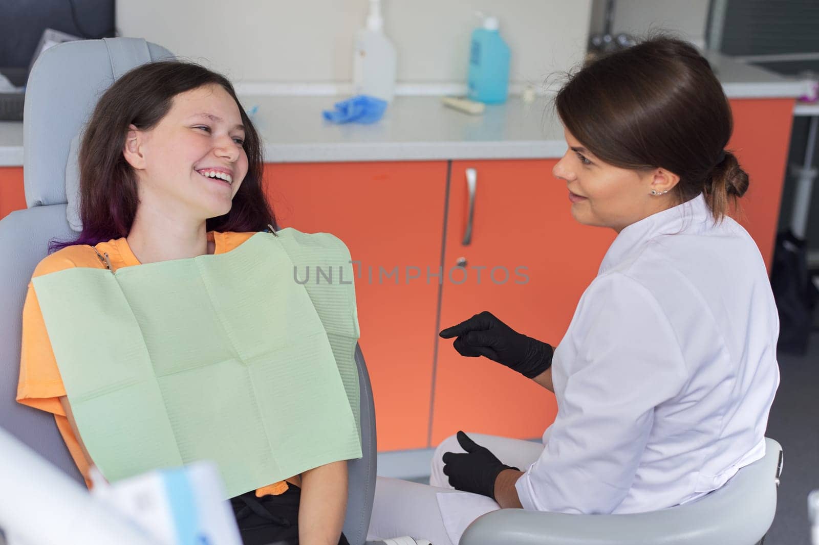 Teenager girl treating teeth at dentist office, consultation of orthodontist dentist by VH-studio