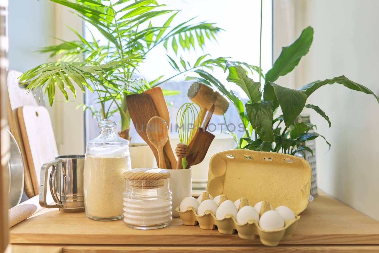 Products, kitchen utensils on the table in pantry.