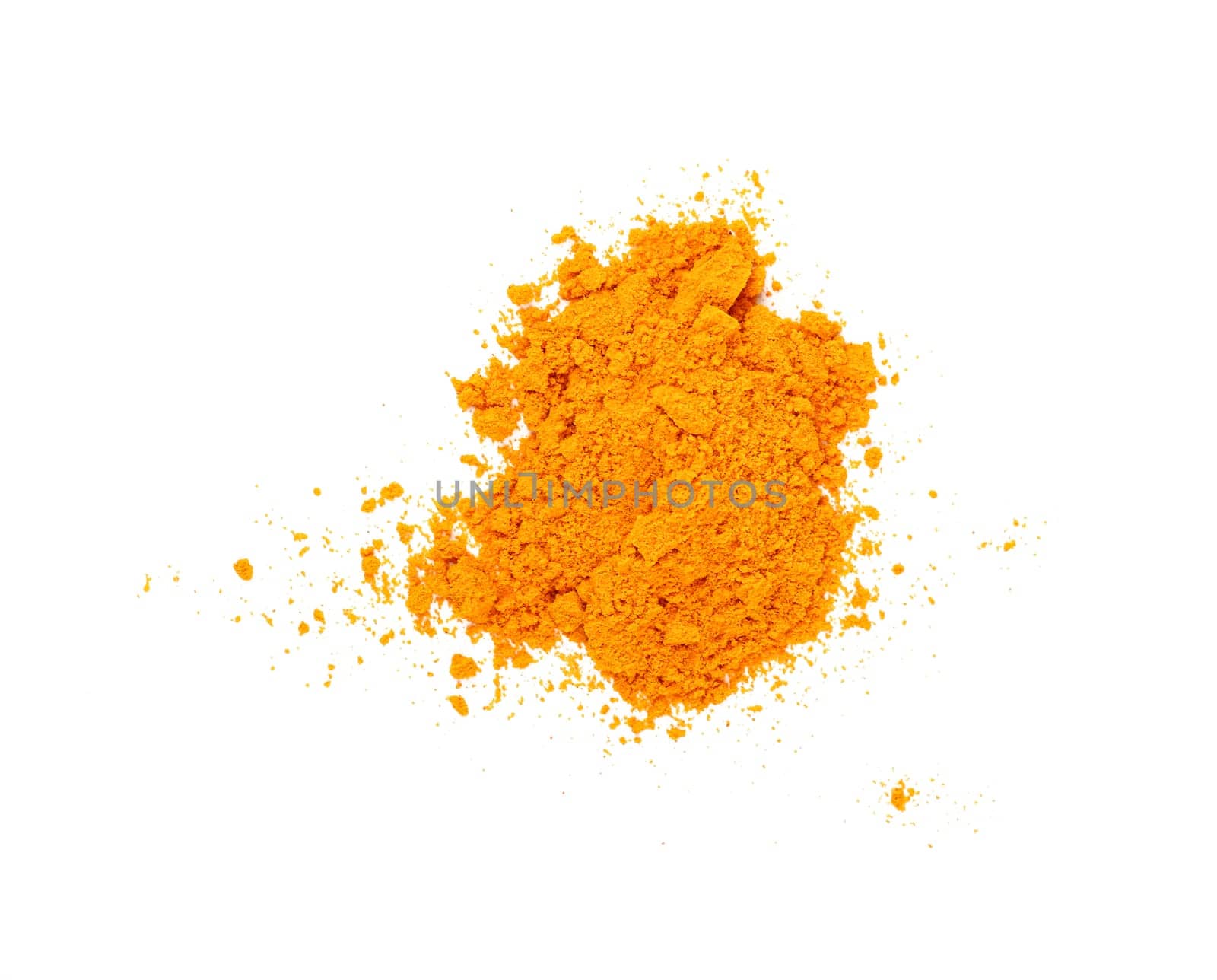 Close up one heap of yellow turmeric spice powder spilled and spread around isolated on white background, elevated top view, directly above