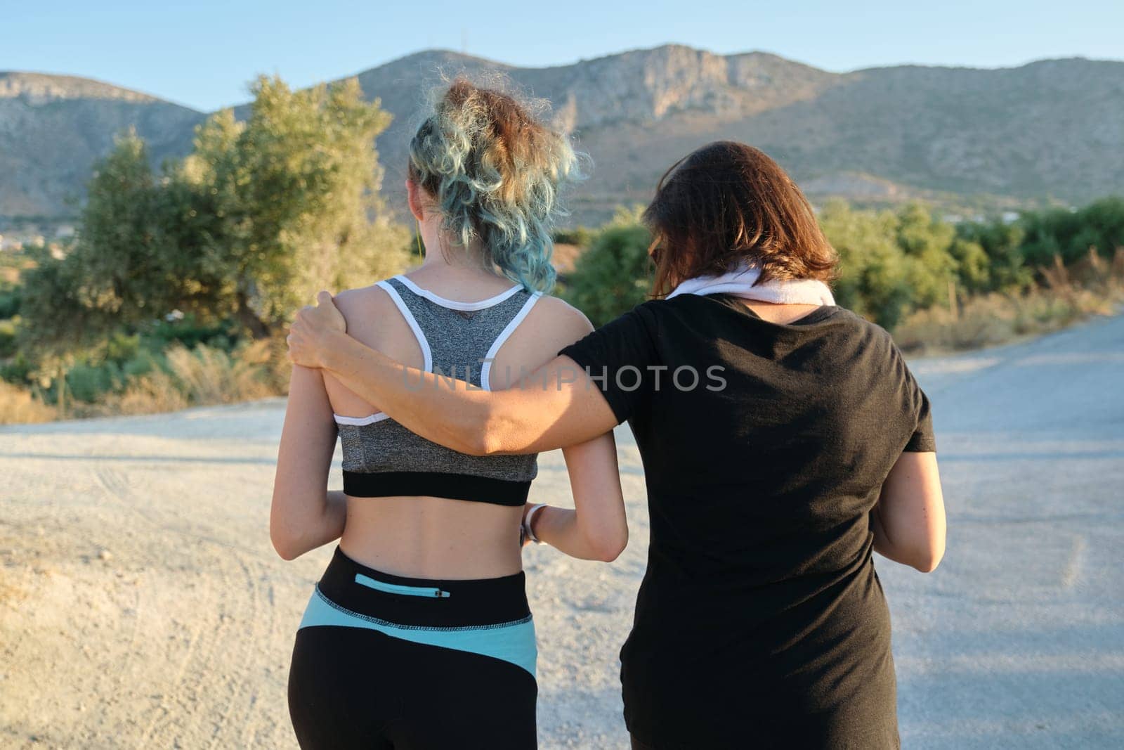 Athletic healthy active family, mother and teenage daughter walking in sportswear by VH-studio