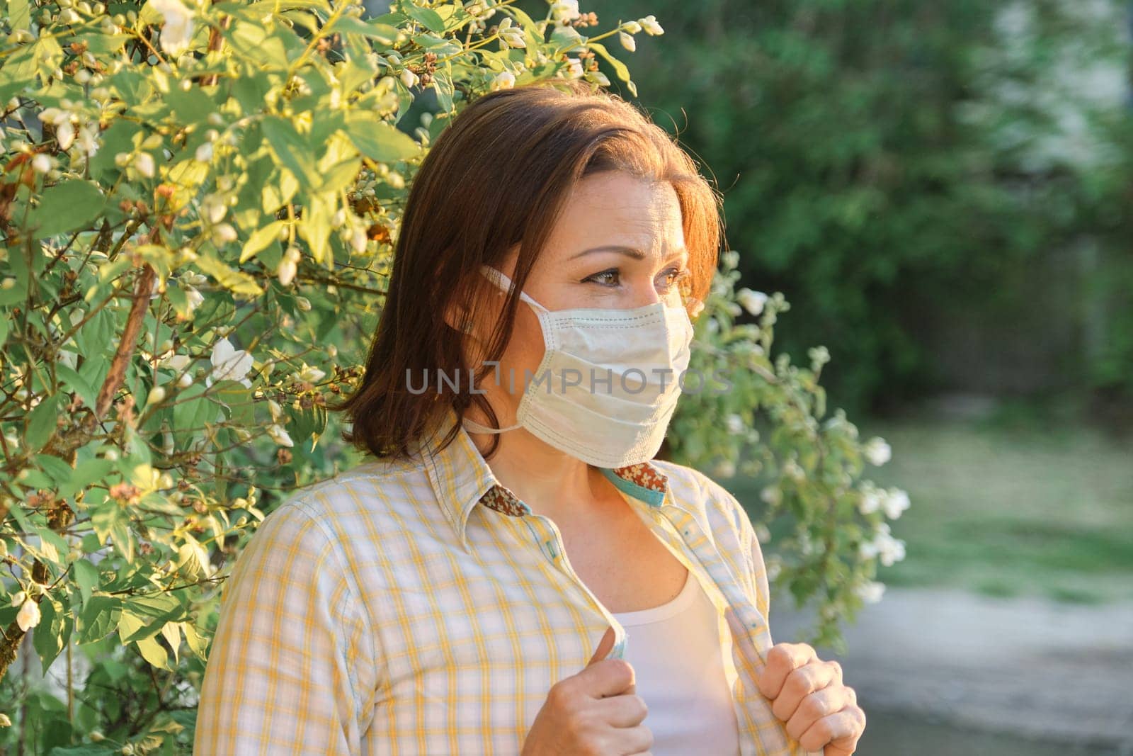 Mature woman in protective medical mask, female outdoor by VH-studio