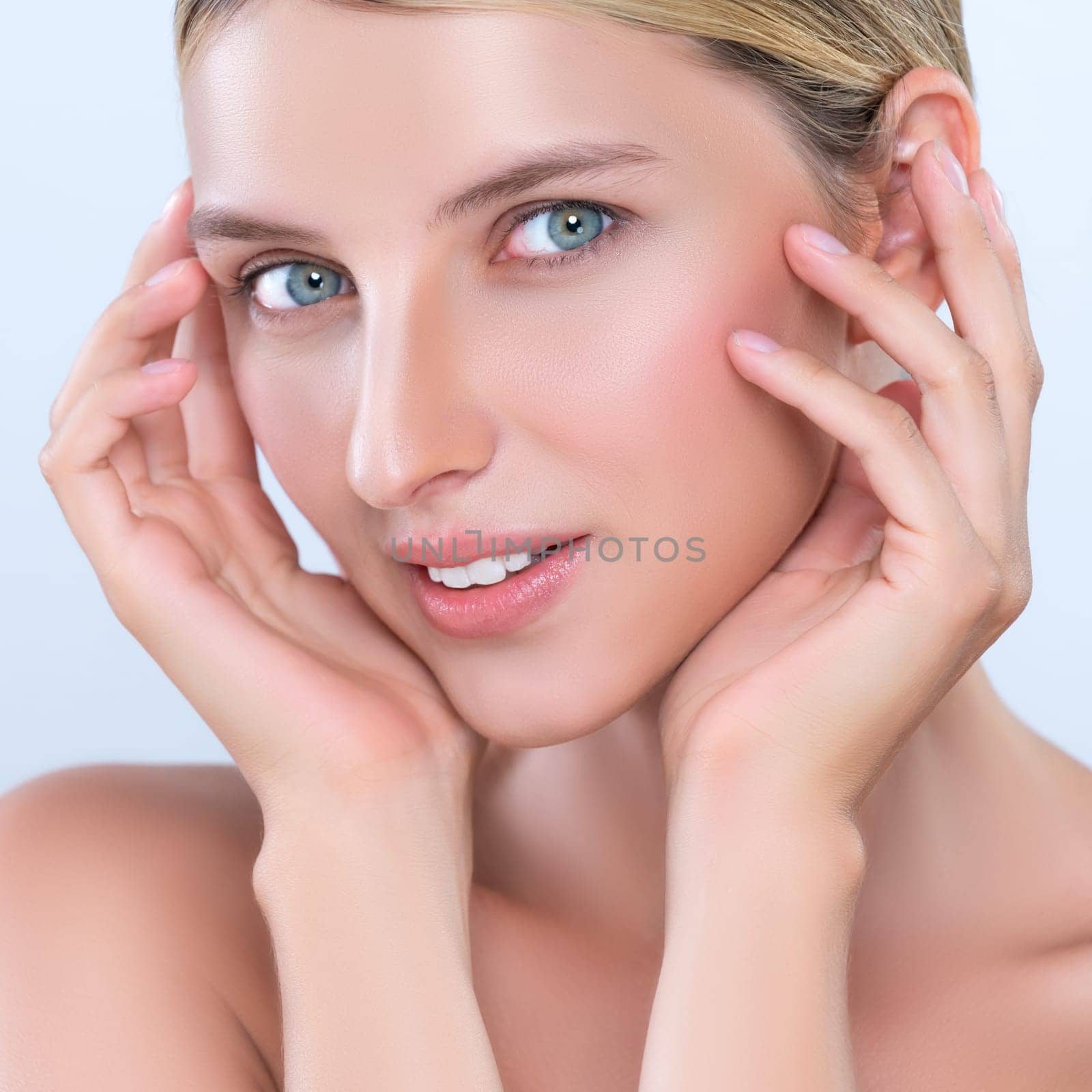 Closeup alluring beautiful woman with perfect smooth and clean skin portrait in isolated background. Beauty hand gesture with expressive facial expression for skincare treatment product or spa.