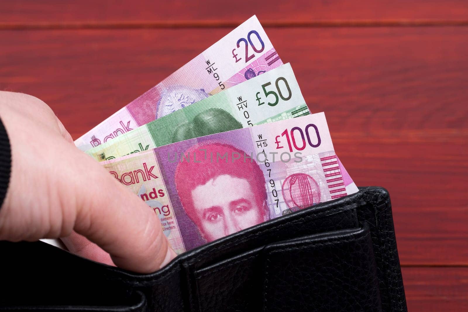 Scottish money - Pound in the black wallet