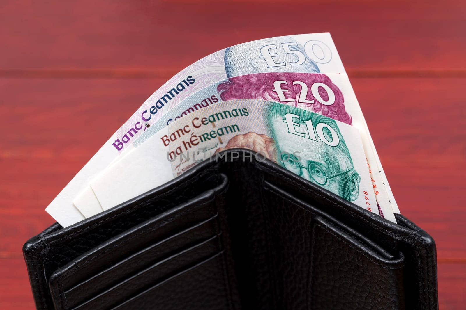 Irish Pounds in a black wallet by johan10