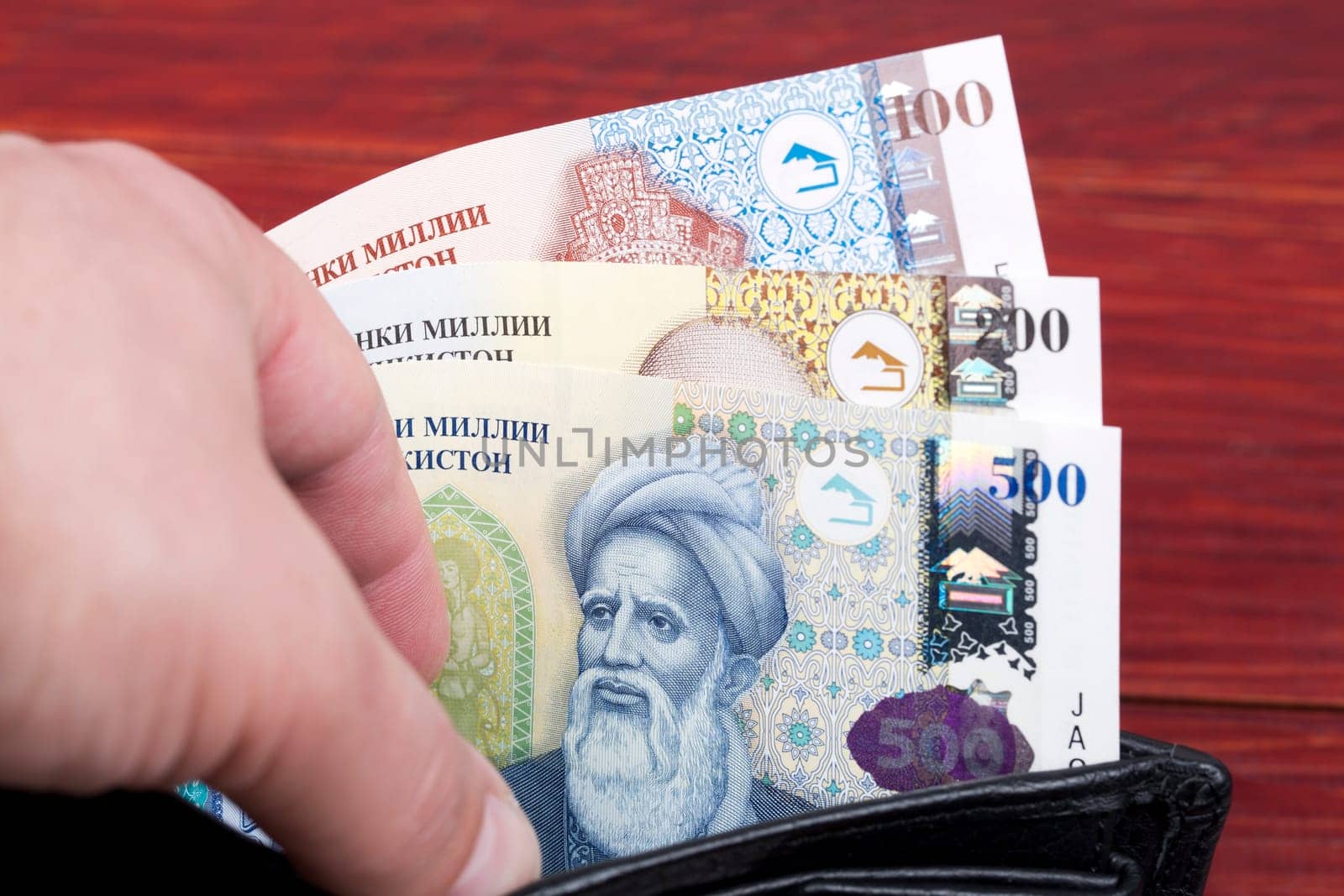 Tajikistani money - somoni in the wallet by johan10