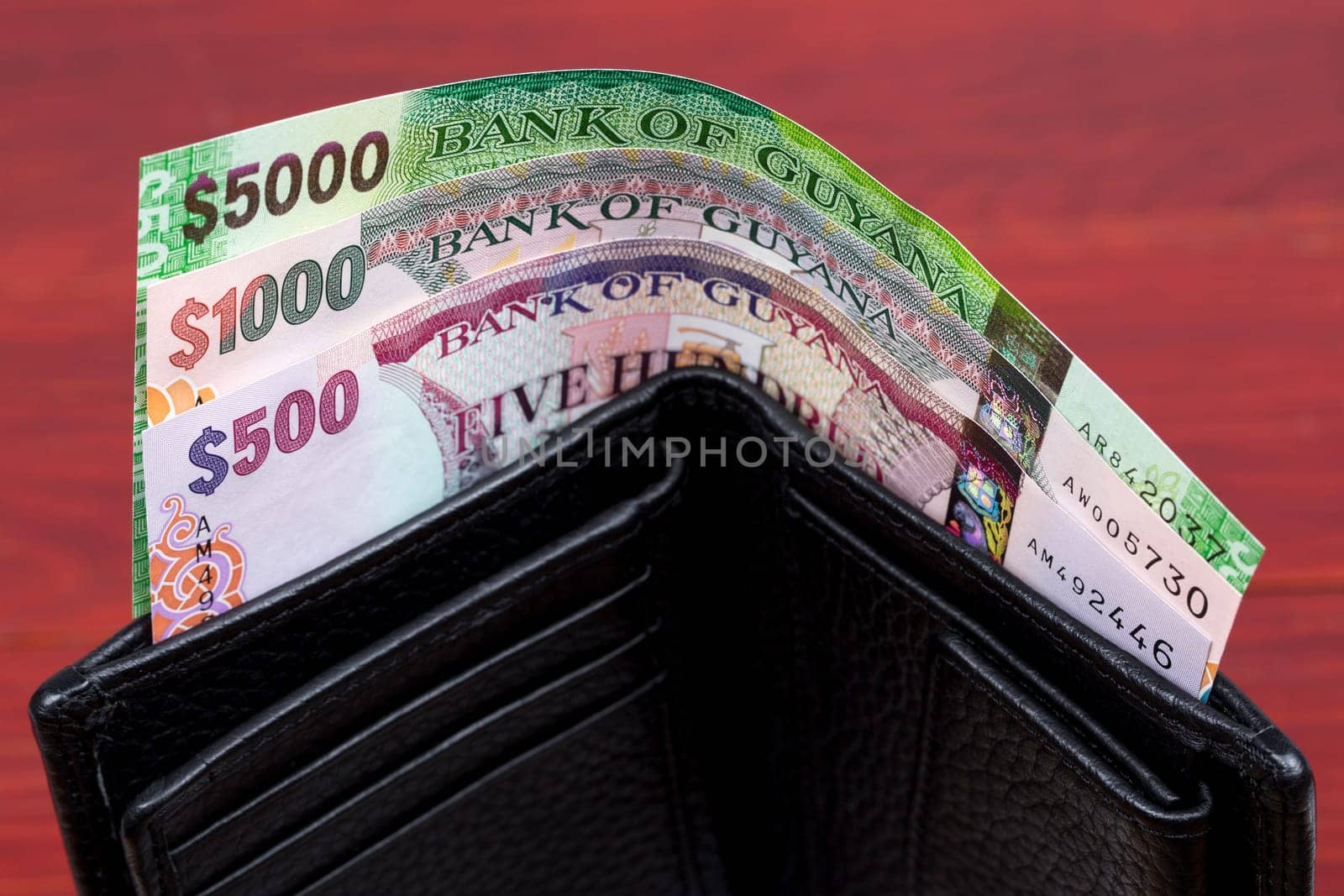 Guyanese dollar in the black wallet