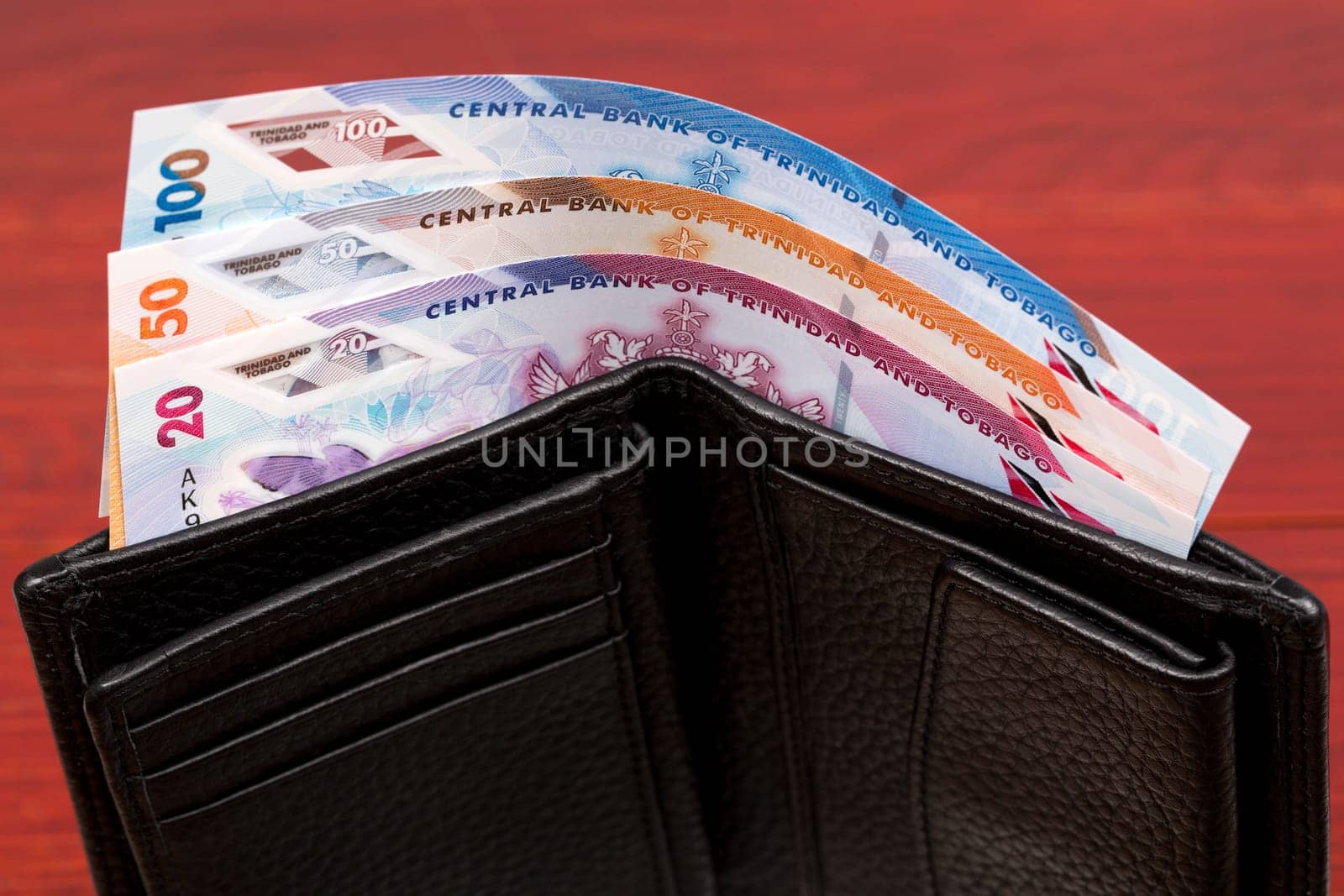 Trinidad and Tobago dollar in the black wallet by johan10