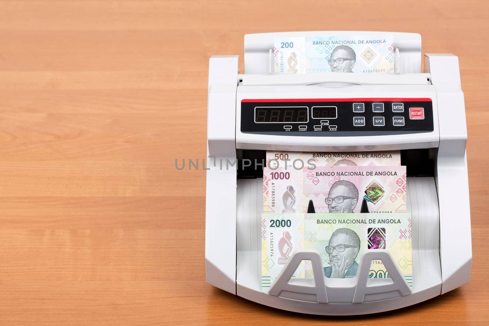 Angolan money - Kwanza a new series of banknotes in the counting machine