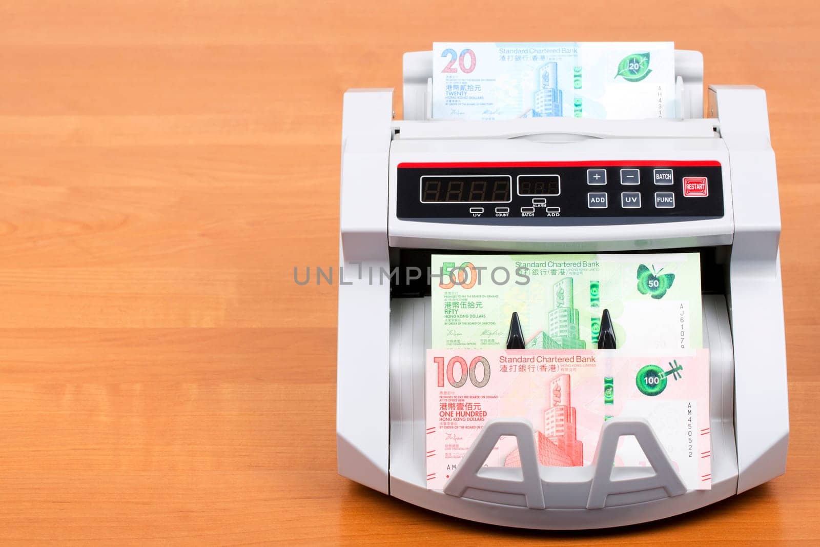 Hong Kong Dollar in the counting machine by johan10