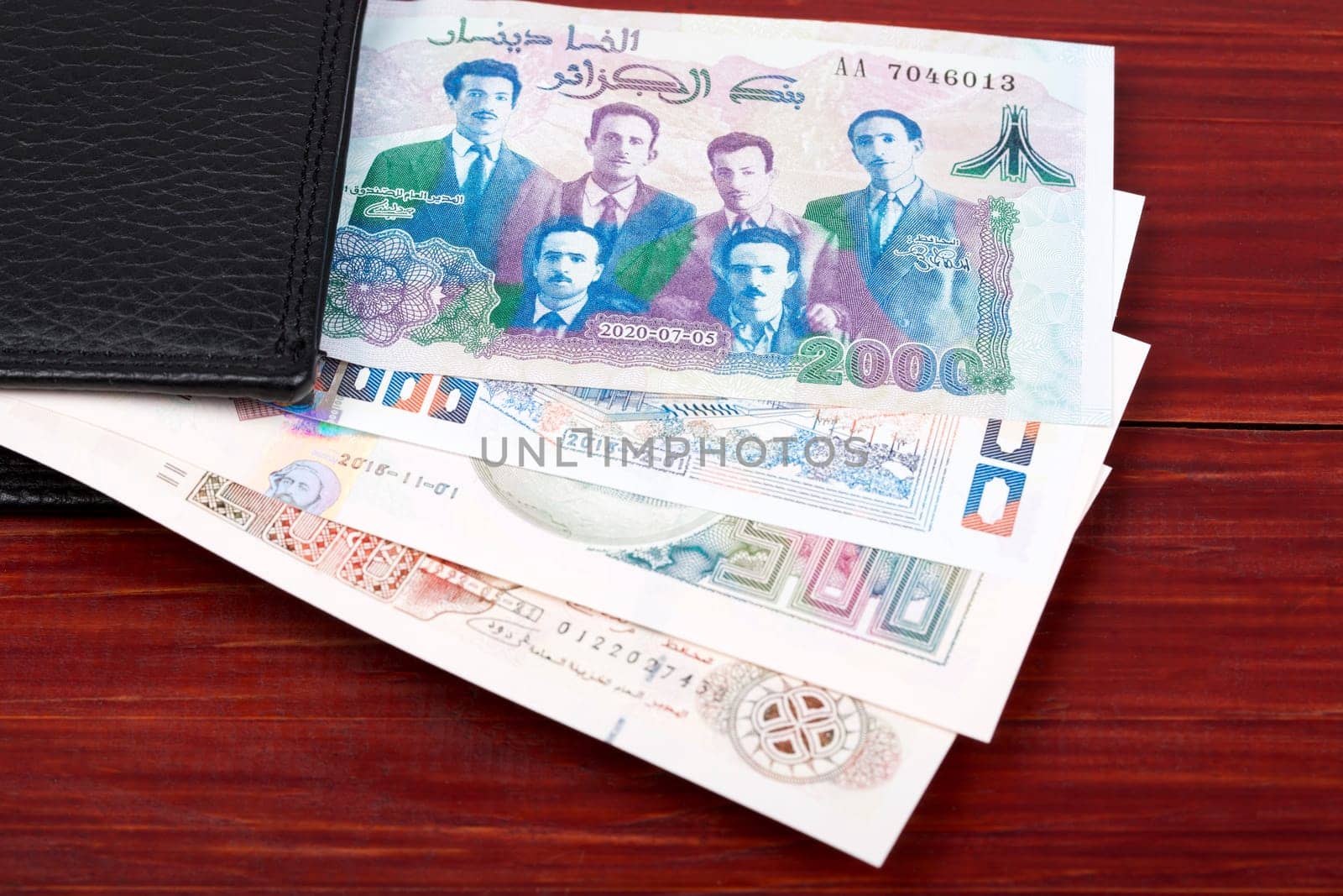 Algerian dinar in the black wallet by johan10