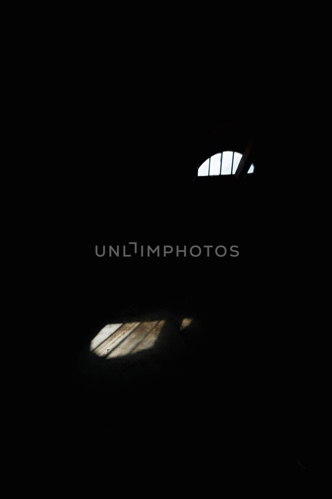 A very dark room with a small window through which sunlight enters the floor by Wierzchu