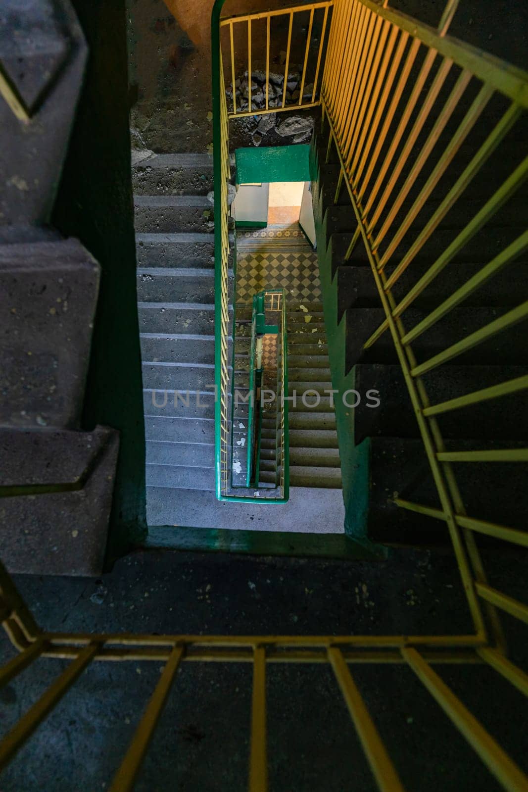 Top view of an old rectangular spiral staircase in an old abandoned building