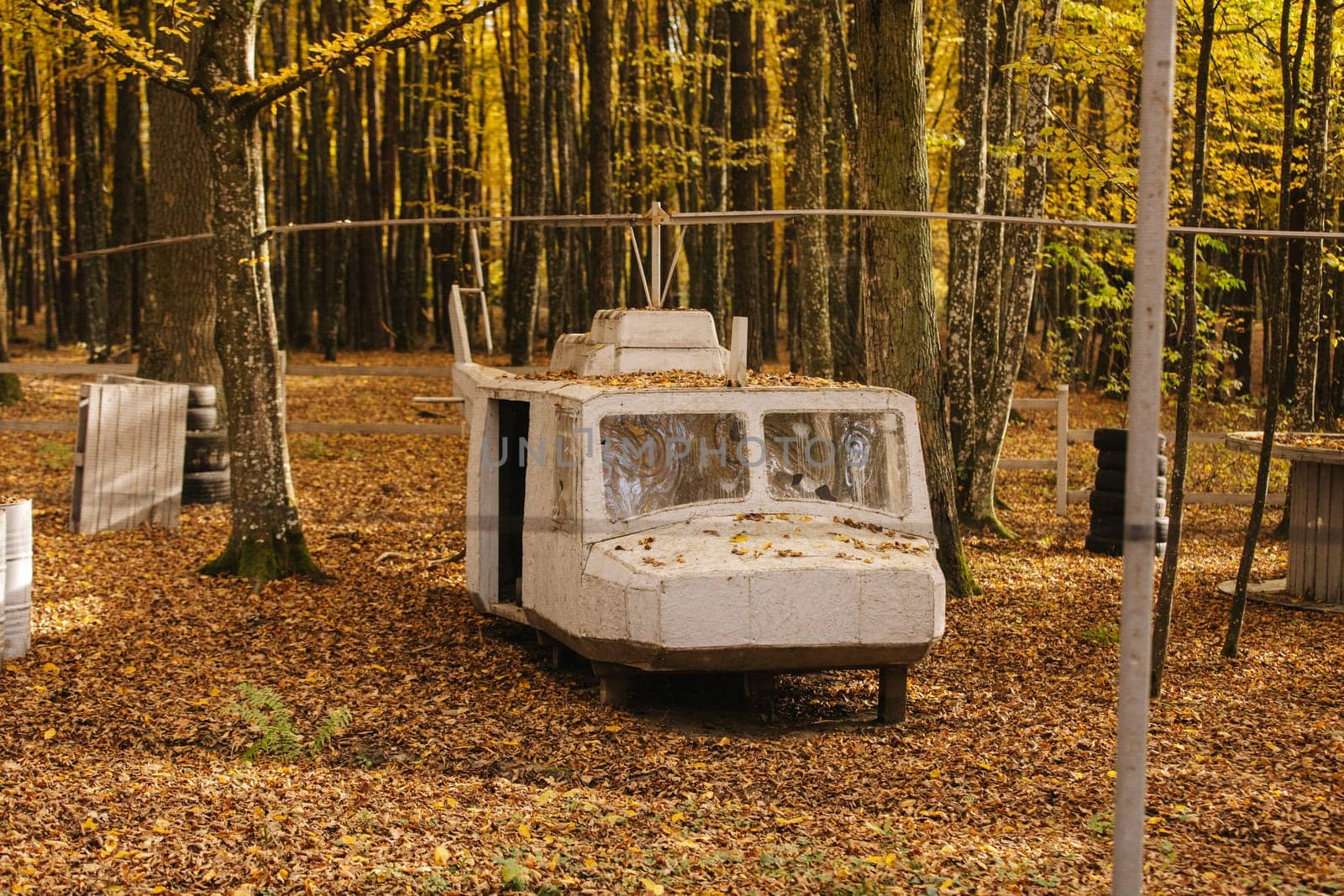 old abandoned helicopter. Autumn park. stone machine in the autumn park.