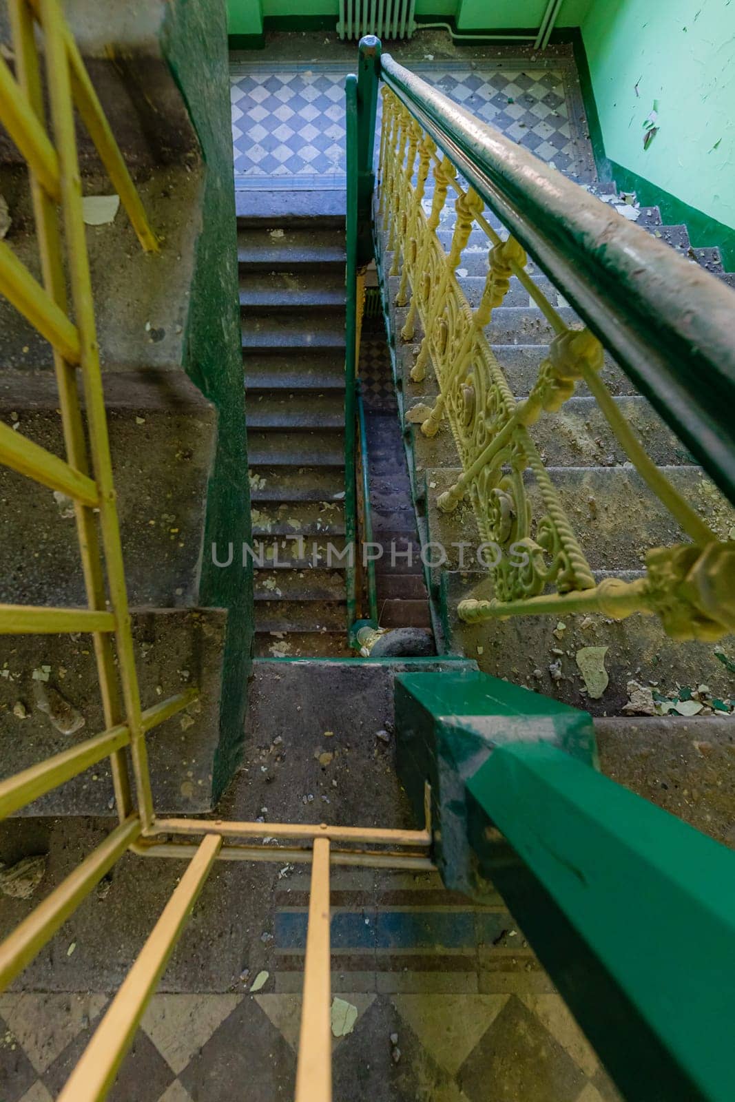 Top view of an old rectangular spiral staircase in an old abandoned building