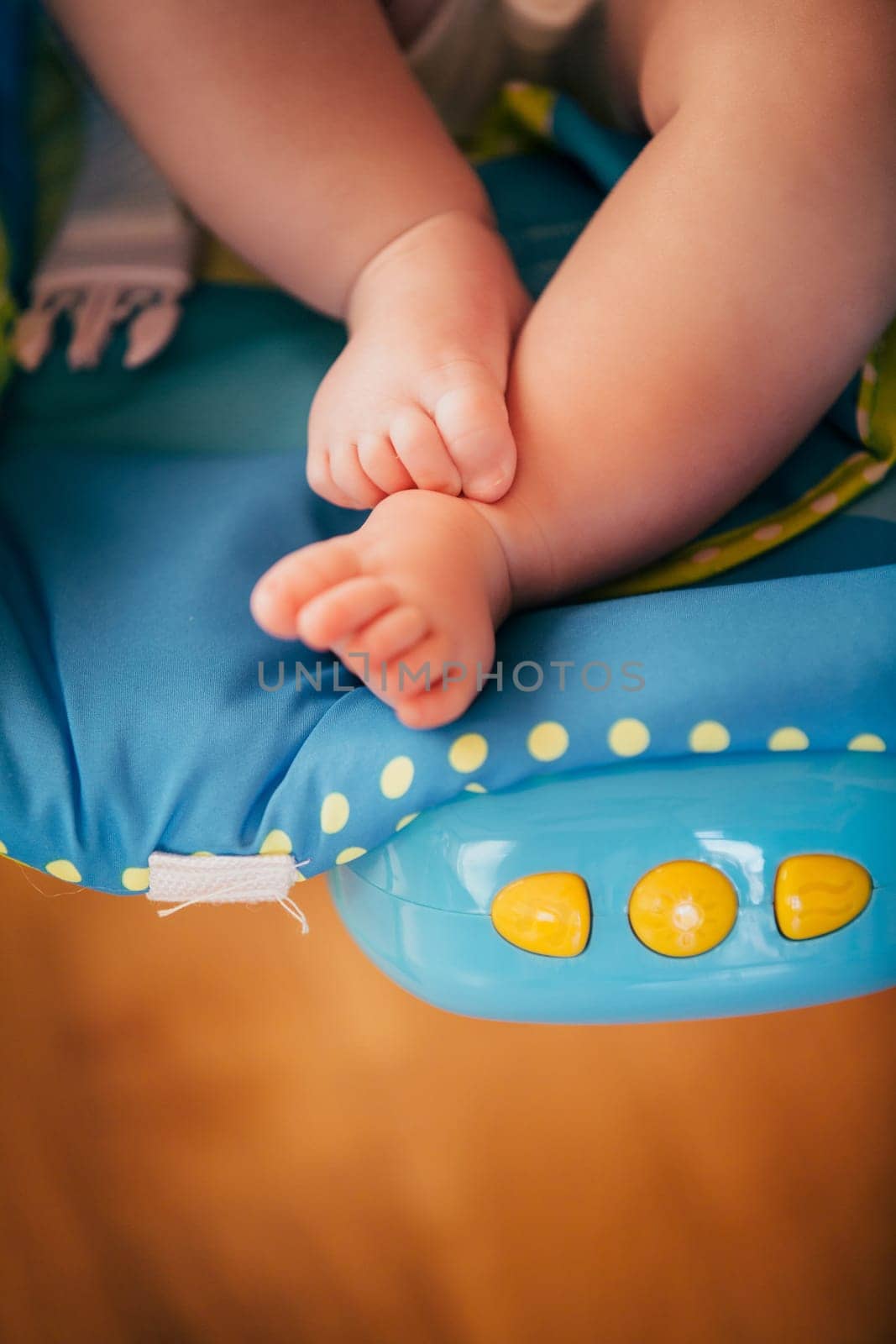 the feet of a small child. Newborn's little fingers. cute little baby feet by Andriimedvediuk