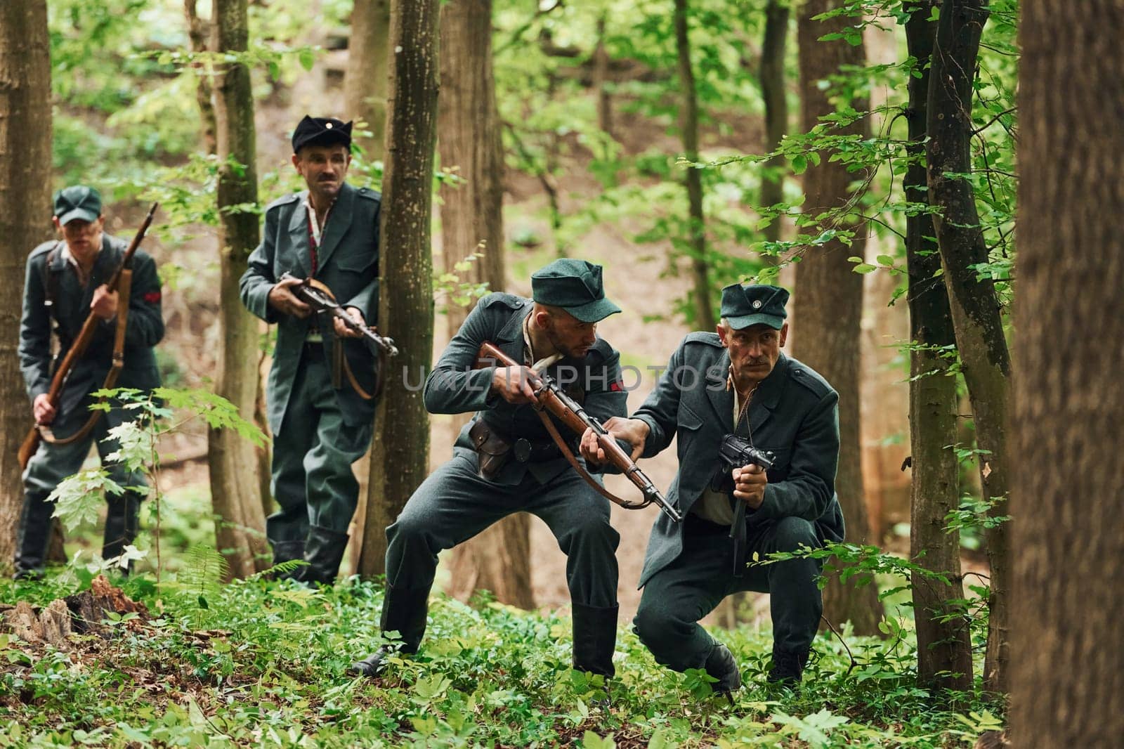 TERNOPIL, UKRAINE - June 2020 UPA Ukrainian Insurgent Army movie filming. Pictures of backstage. Young and old soldiers with weapons is attacking.