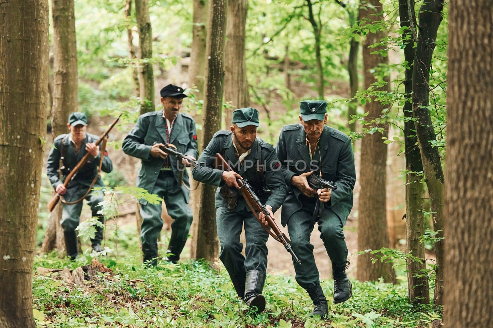 TERNOPIL, UKRAINE - June 2020 UPA Ukrainian Insurgent Army movie filming. Pictures of backstage. Young and old soldiers with weapons is attacking.