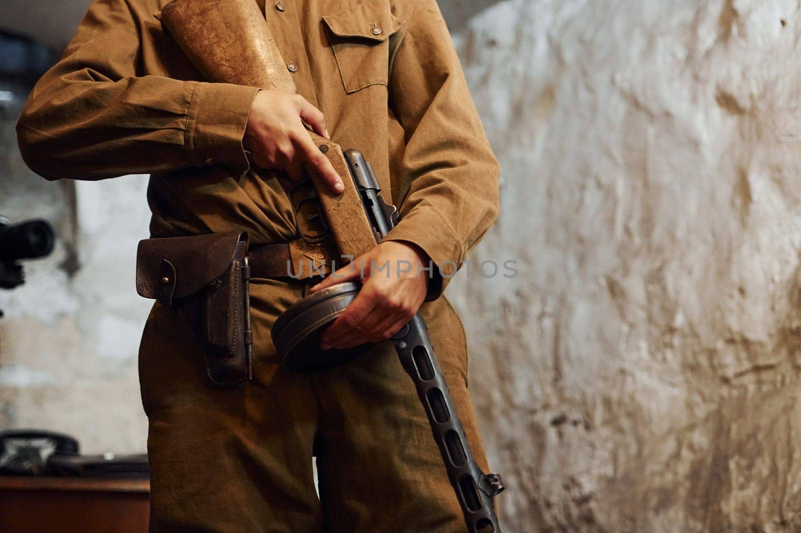 TERNOPIL, UKRAINE - June 2020 UPA Ukrainian Insurgent Army movie filming. Pictures of backstage. Young soldier indoors with weapon.