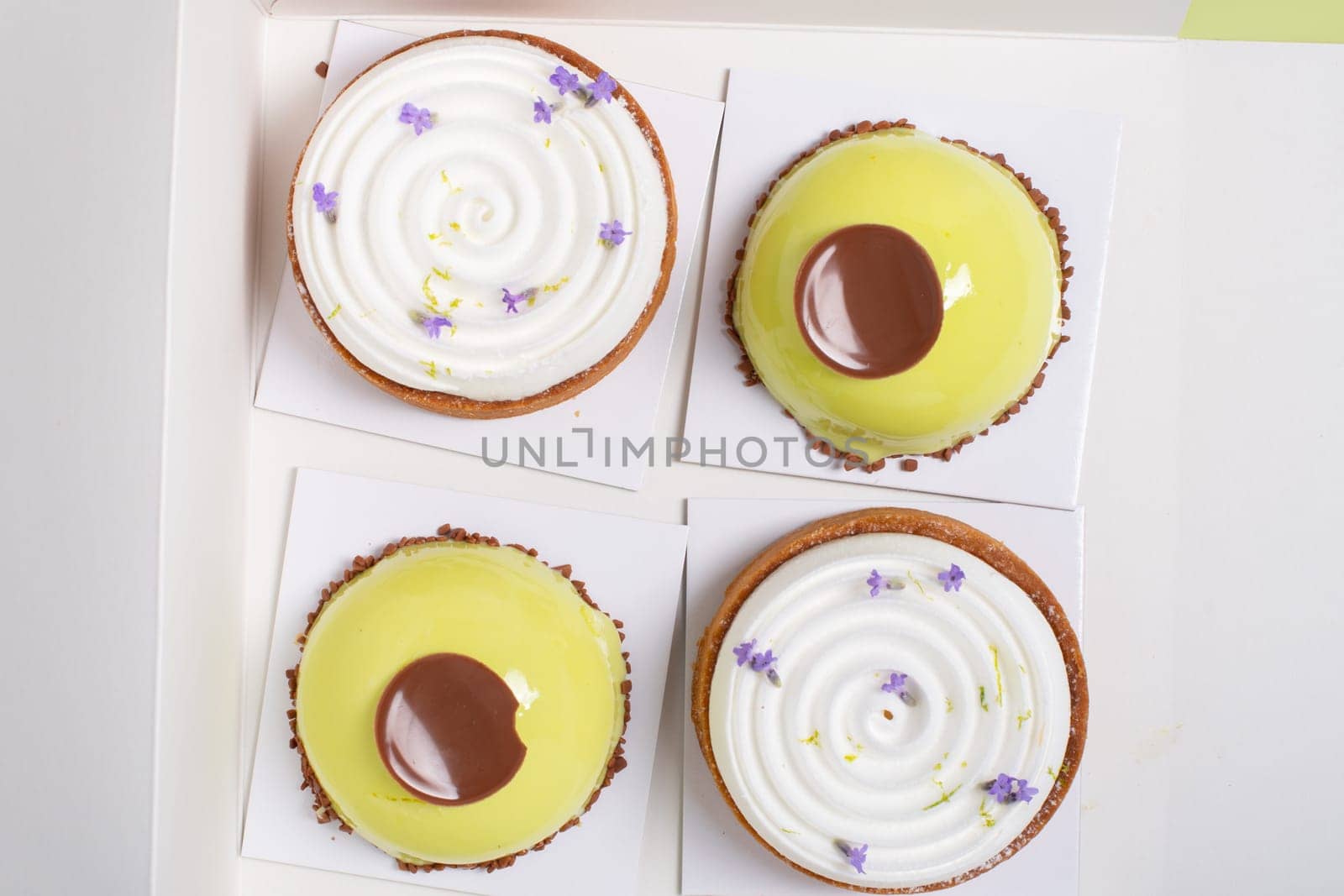 a variety of original cakes in a white box top view, cooking with home delivery, High quality photo