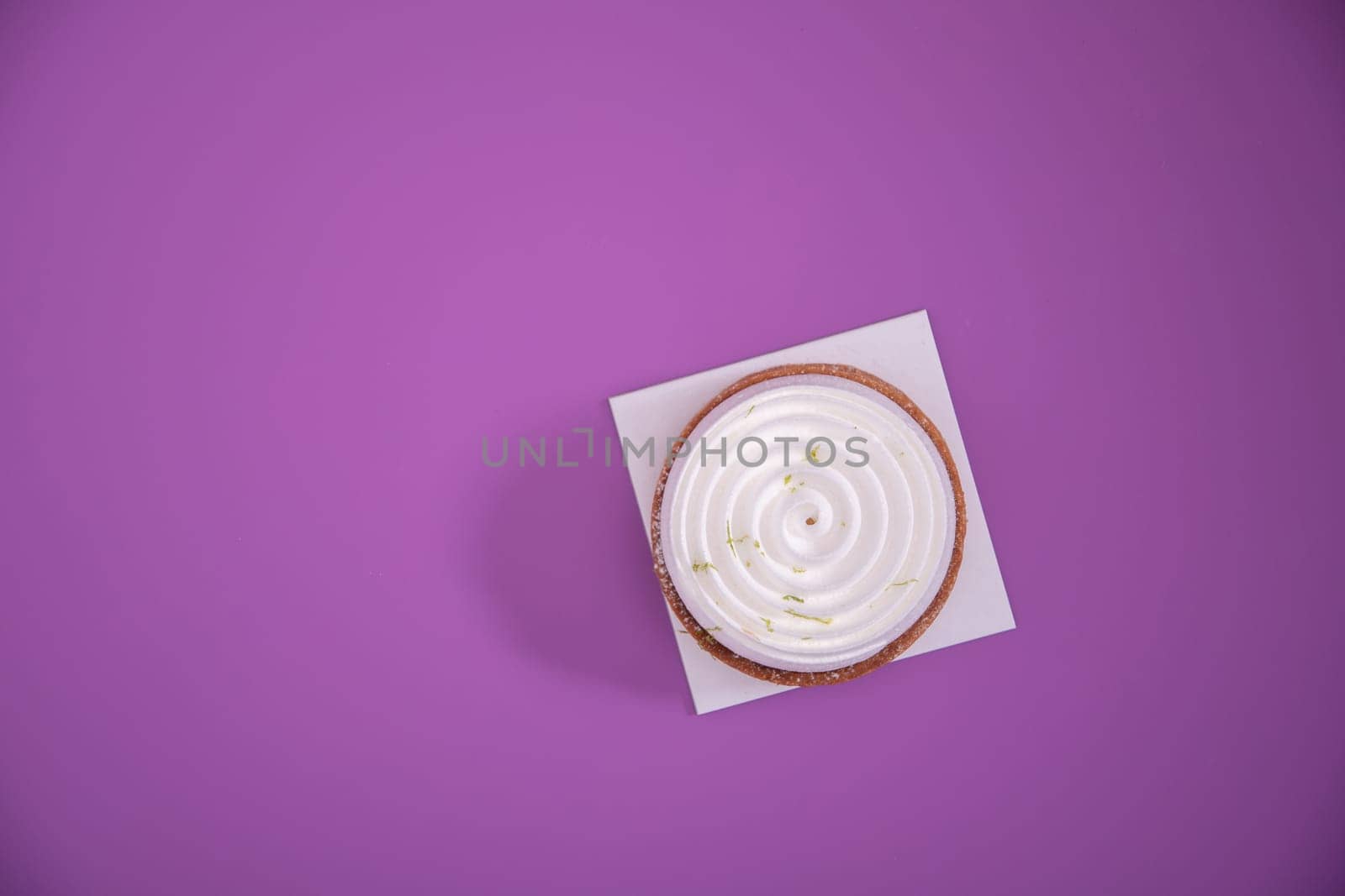 Mousse cake, top view, decorated with lavender flowers on a purplr background, High quality photo