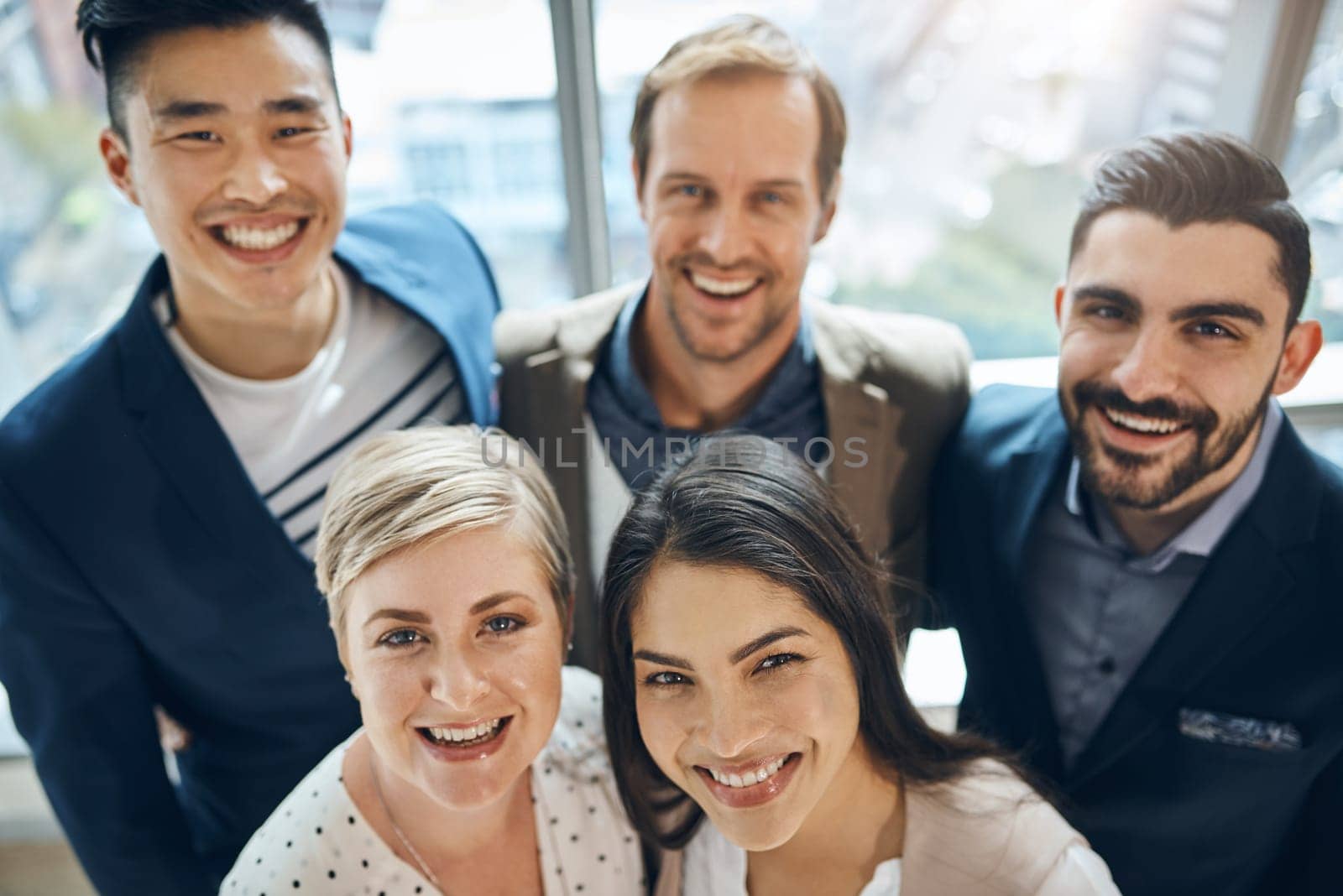 Confident and going places. Portrait of a group of confident young businesspeople standing together in the office at work during the day