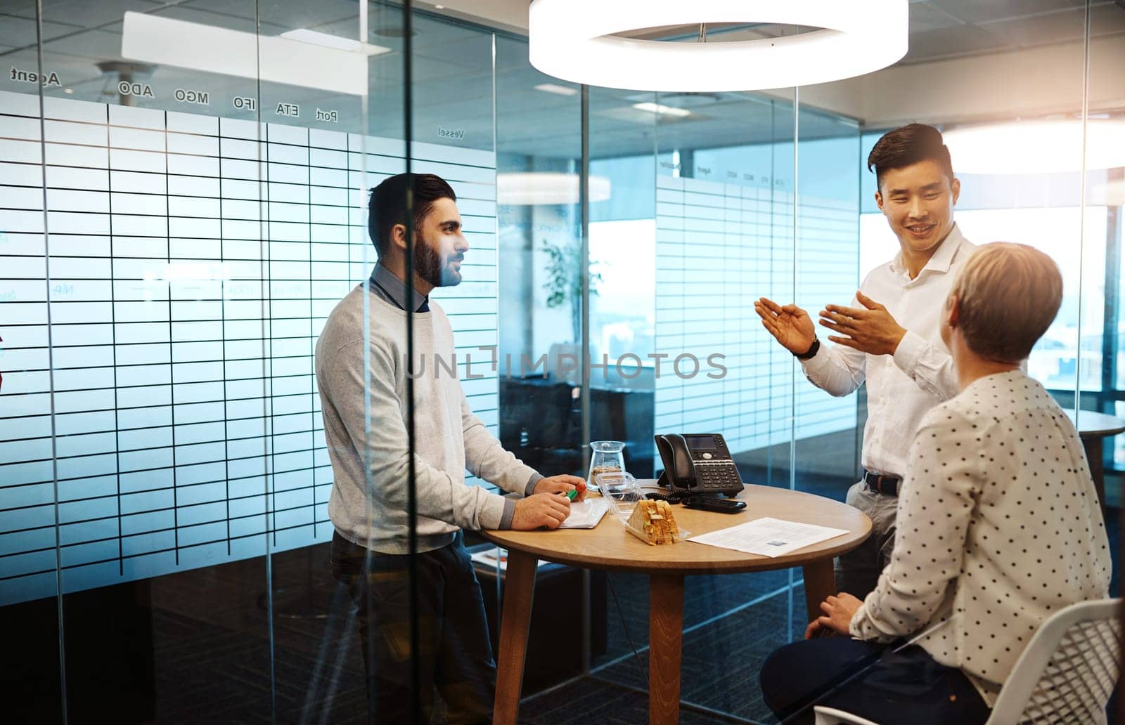 He has a vision for this company. three young businesspeople having a meeting in their office