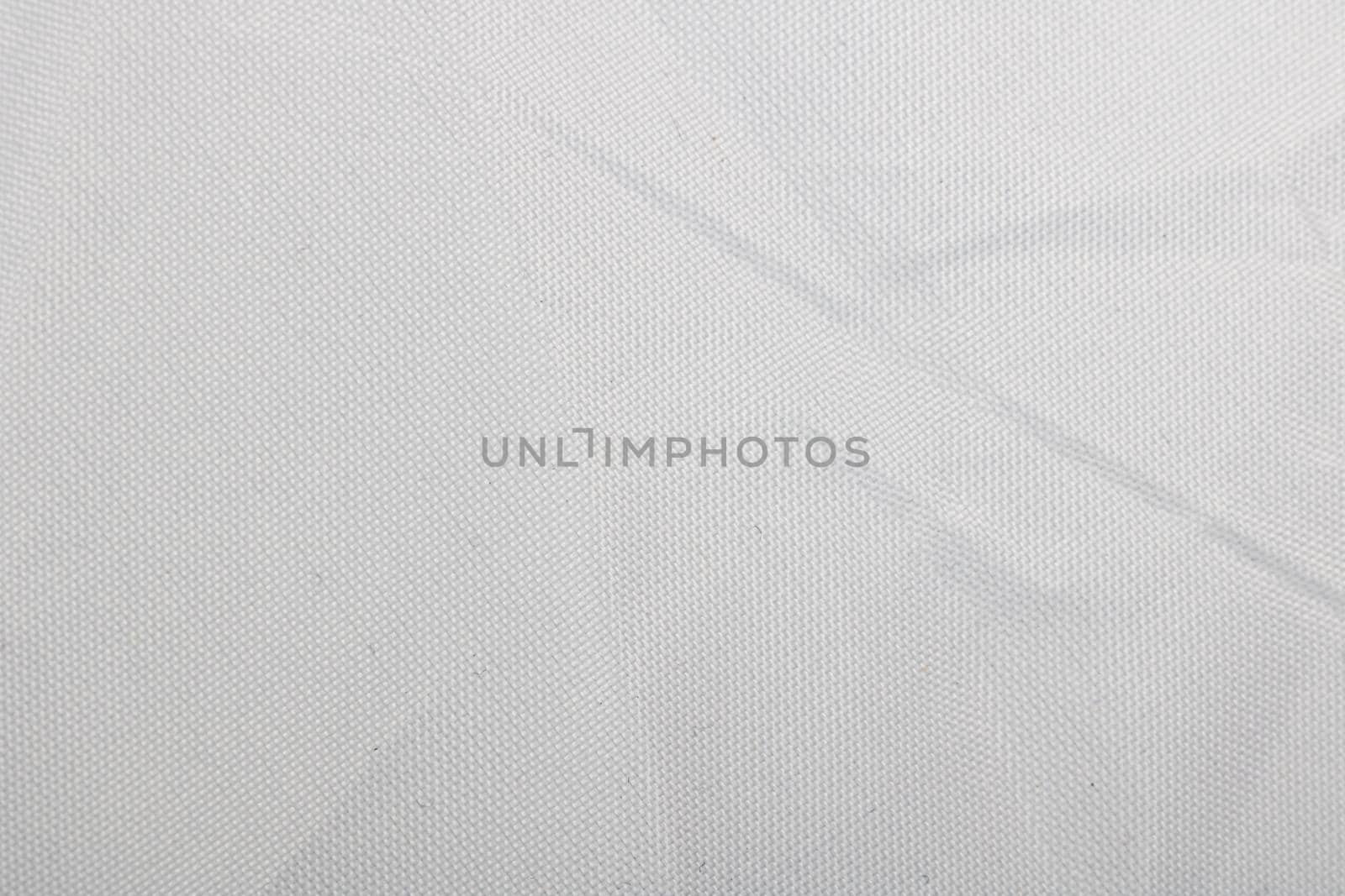 White pleated fabric close up, texture or background for text