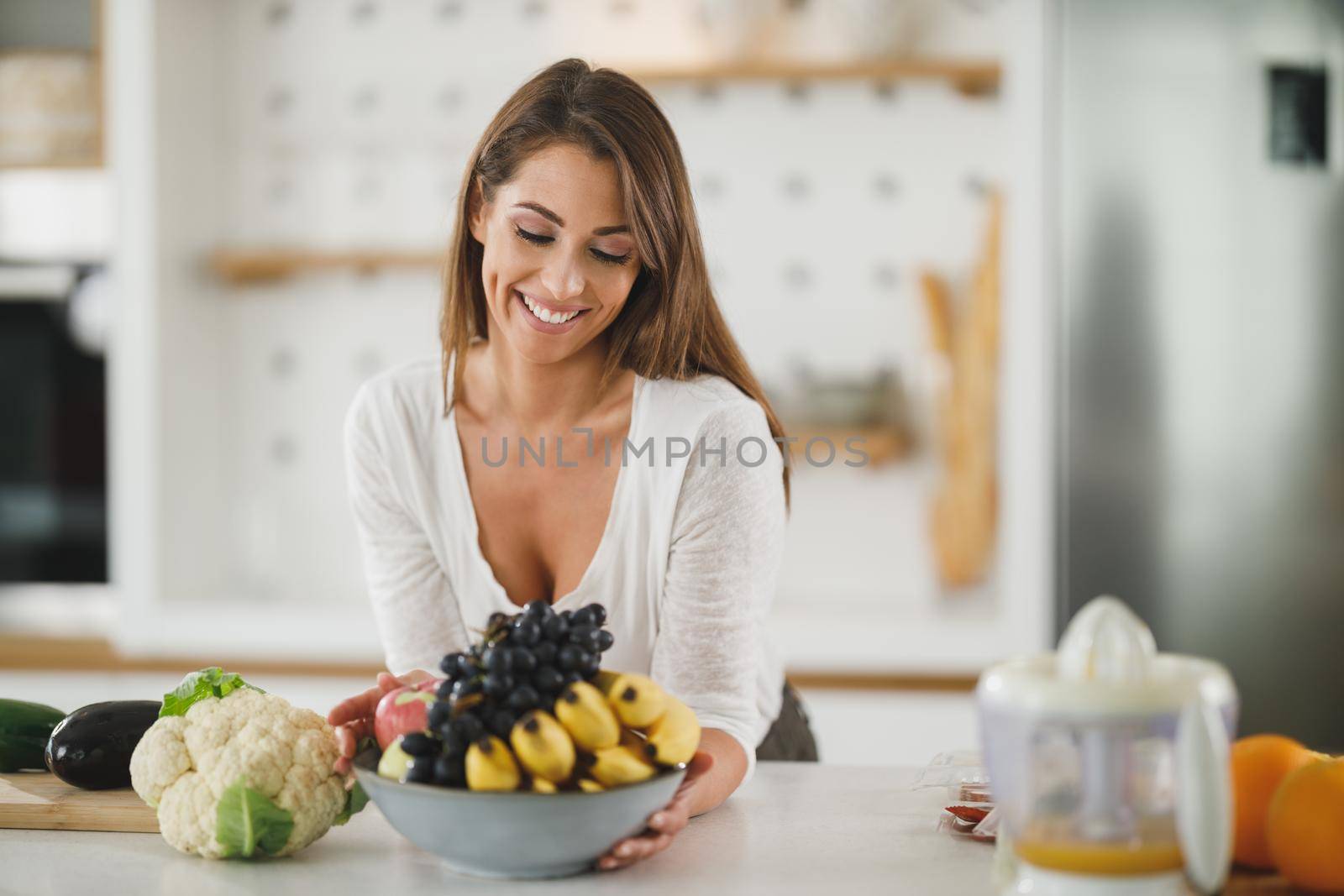 Shot of a young woman preparing a healthy meal in her kitchen.