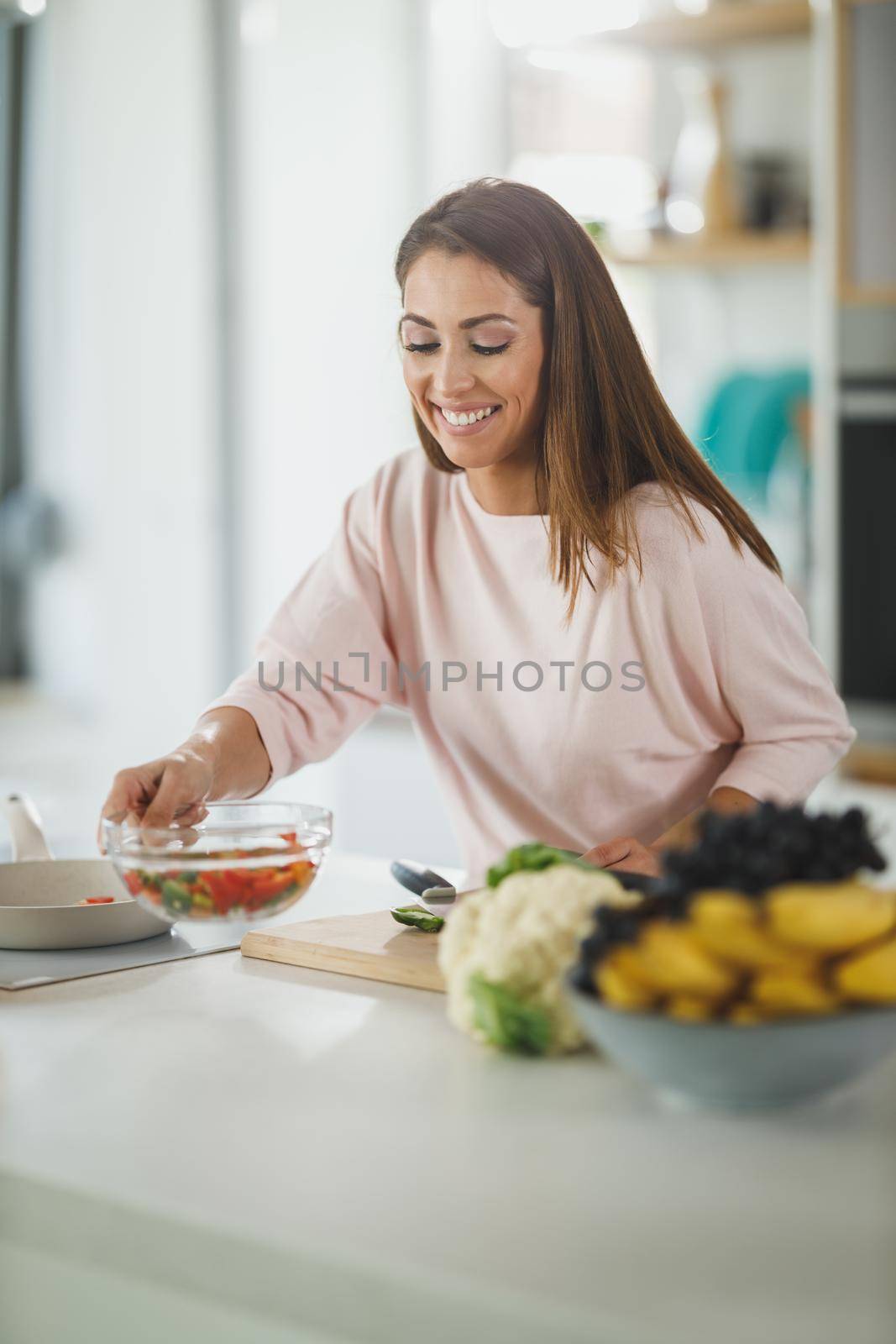 Shot of a young woman preparing a healthy meal in her kitchen.