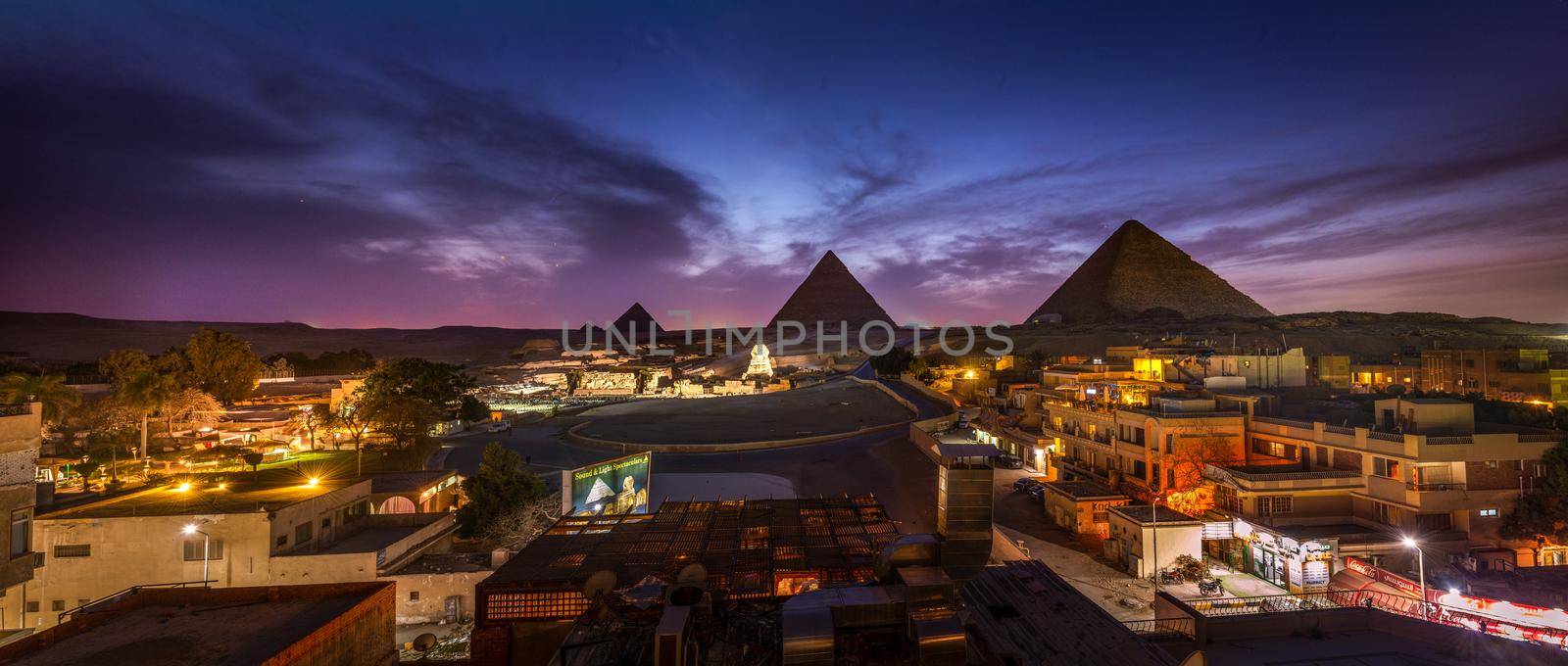 The Pyramids and the Sphinx in the night lights, Giza, Egypt