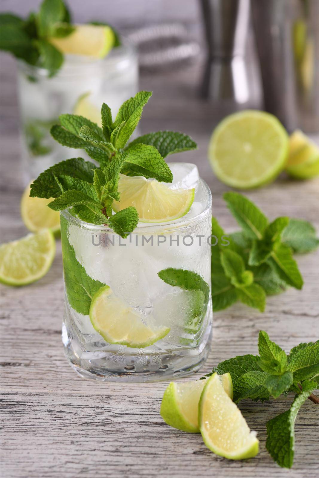 Refreshing summer alcoholic cocktail mojito with ice, fresh mint and lime