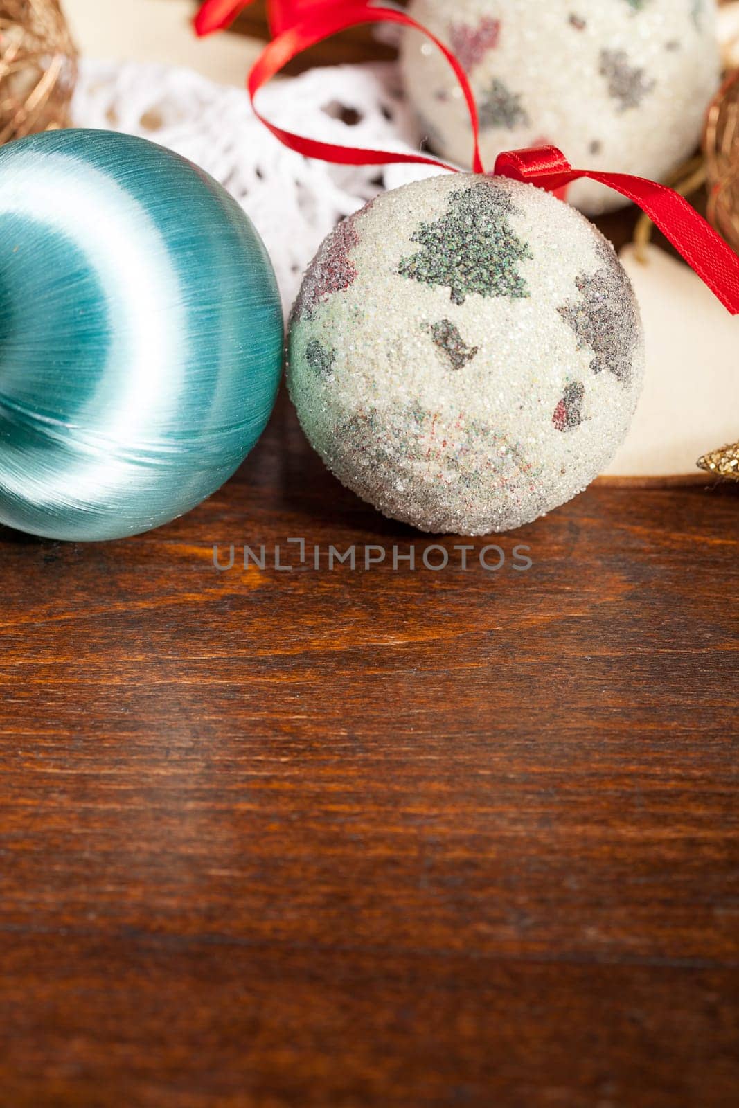 Christmas balls decorations on wooden table. Studio photo