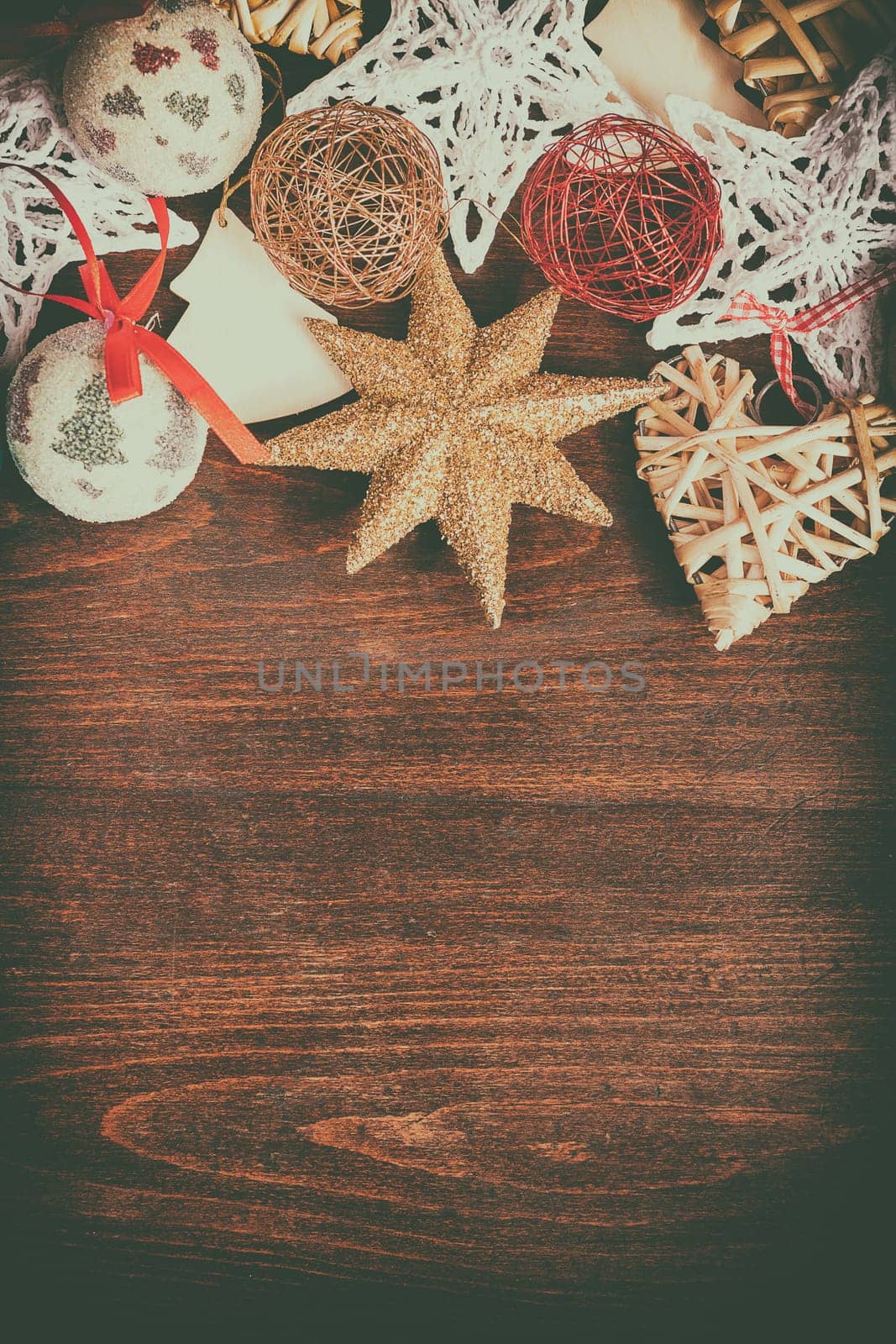 Christmas decoration in vintage toning on wooden background by DCStudio